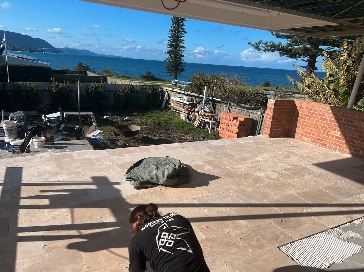 Back patio in travertine tiles — Bulli Point