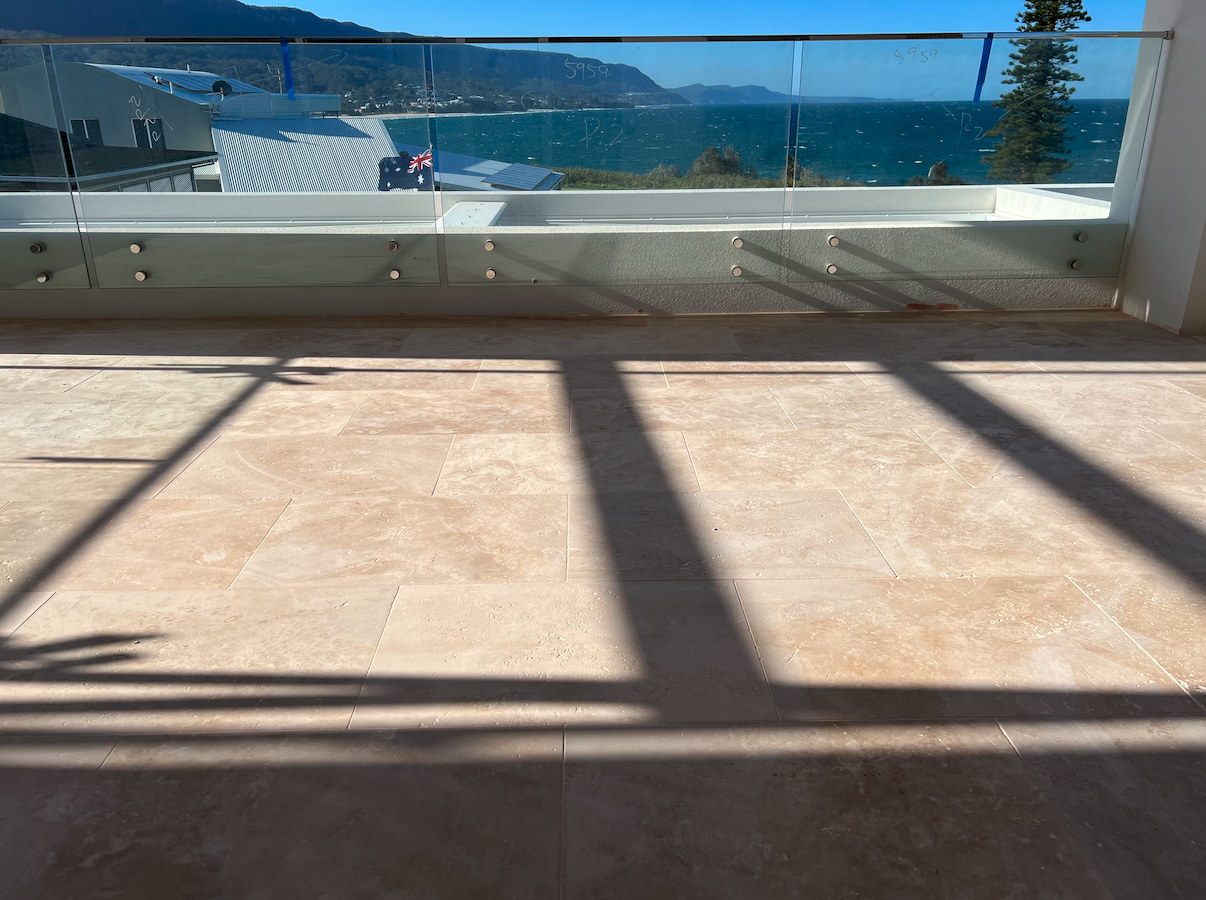 Upstairs entertaining patio in travertine — Bulli Point