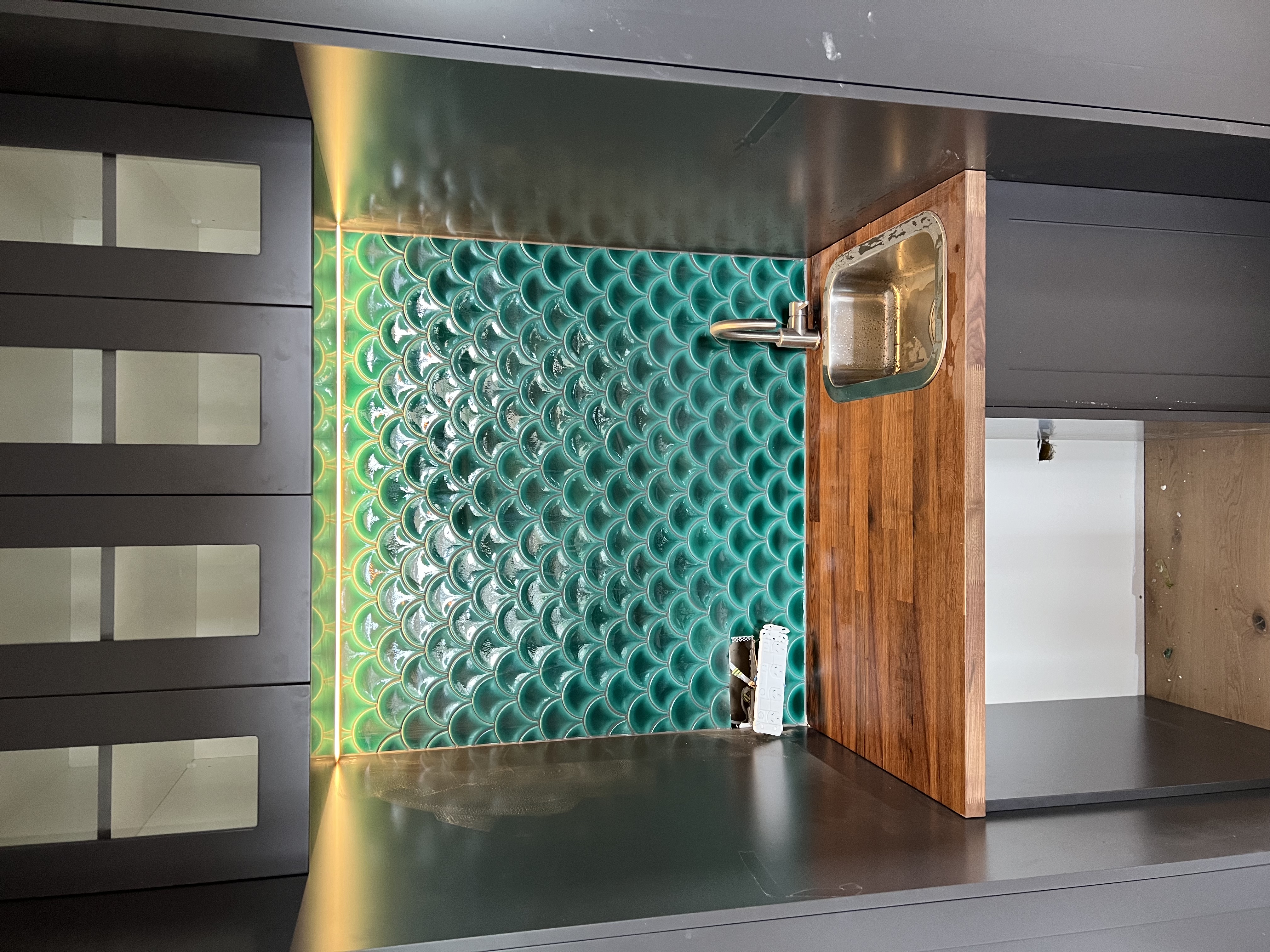Green fishscale kitchen splashback detail — Corrimal