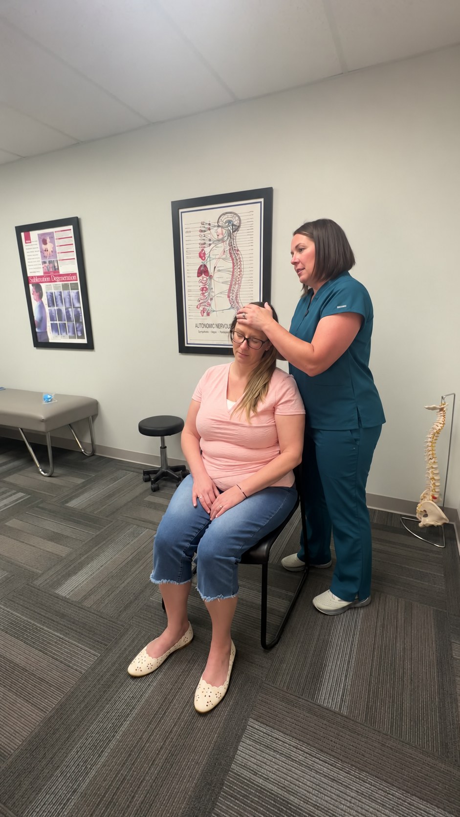 An Althoff Wellness Clinic provider checking a patient's neck range of motion during a neck exam at Althoff Wellness Clinic in Cheyenne, WY
