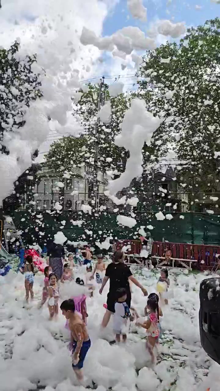 Friends enjoying a colorful foam party
