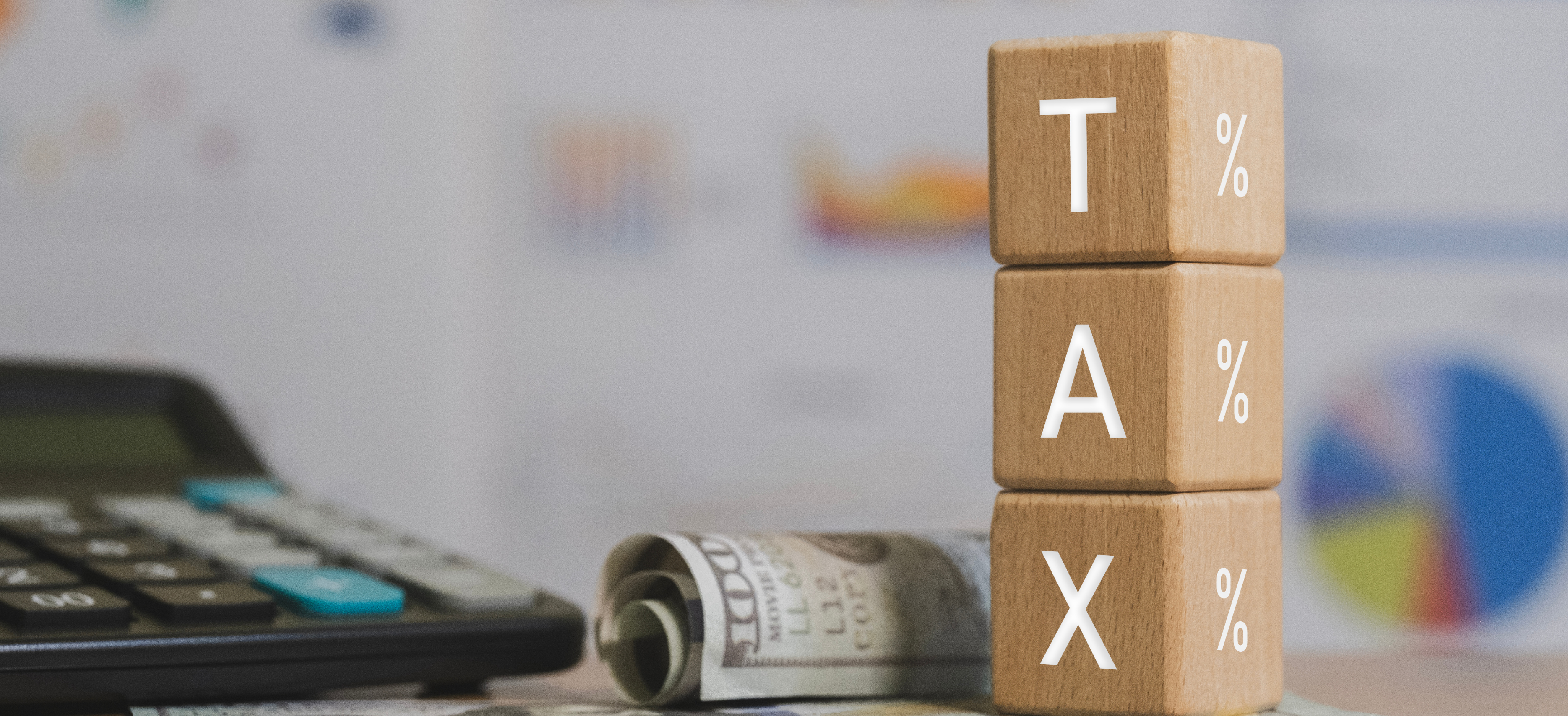 Attorney tax planning concept with 2026 tax blocks, Form 1040, and calculator