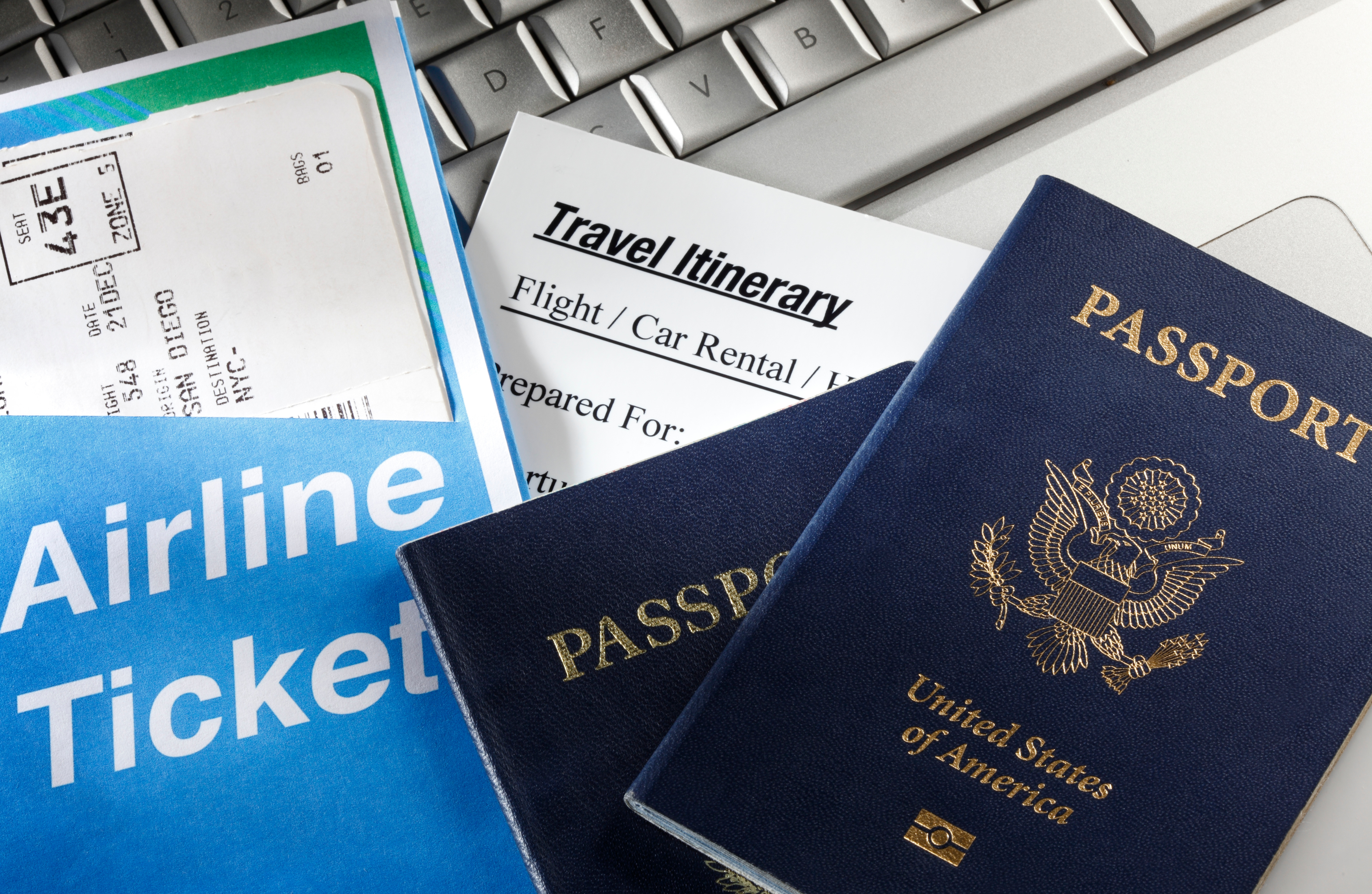 Attorney business travel documents with airline ticket, itinerary, and passports illustrating deductible law firm travel expenses and audit-ready recordkeeping in 2026