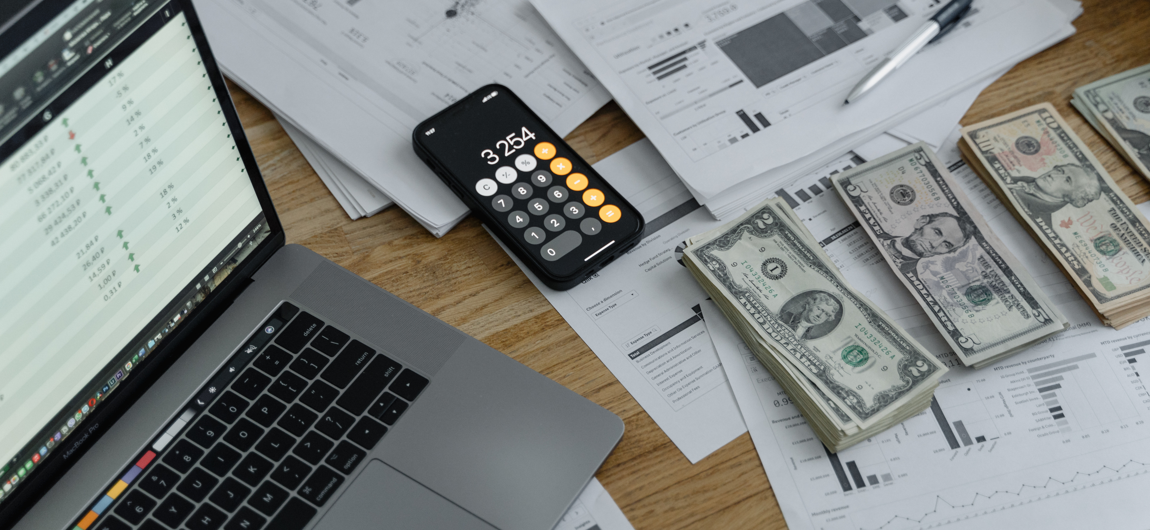 Lawyer reviewing law firm finances, cash flow, and financial documents on a desk