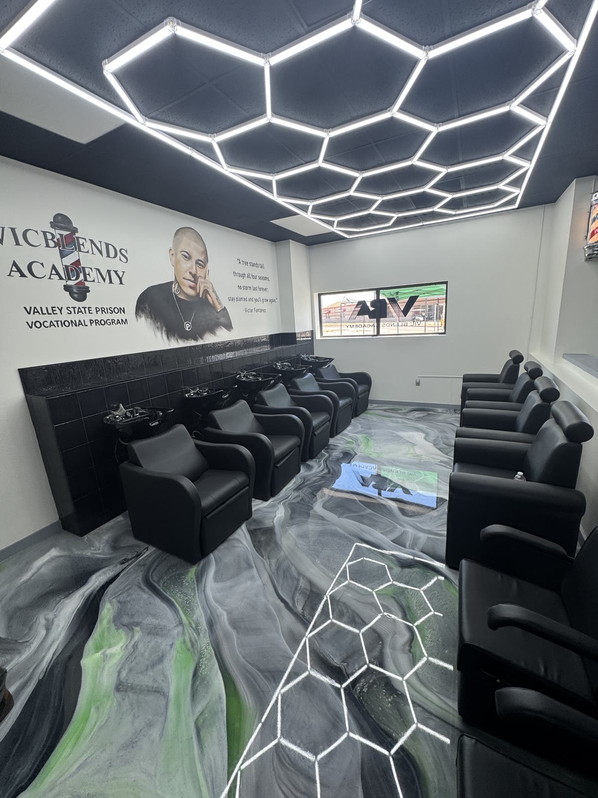 Vic Blends Academy wash stations and black chairs on a gray and green metallic epoxy floor, installed by Exclusive Resins