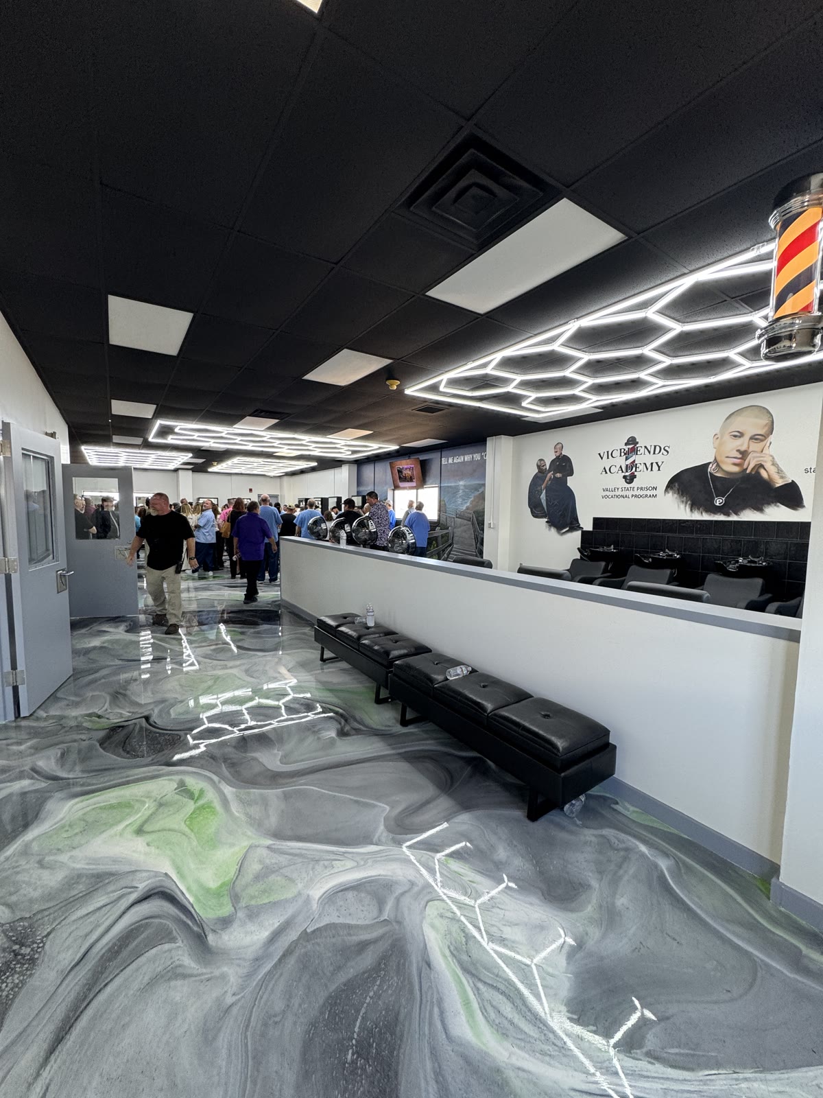 Vic Blends Academy lobby with benches, wash stations and a gray and green metallic epoxy floor, installed by Exclusive Resins