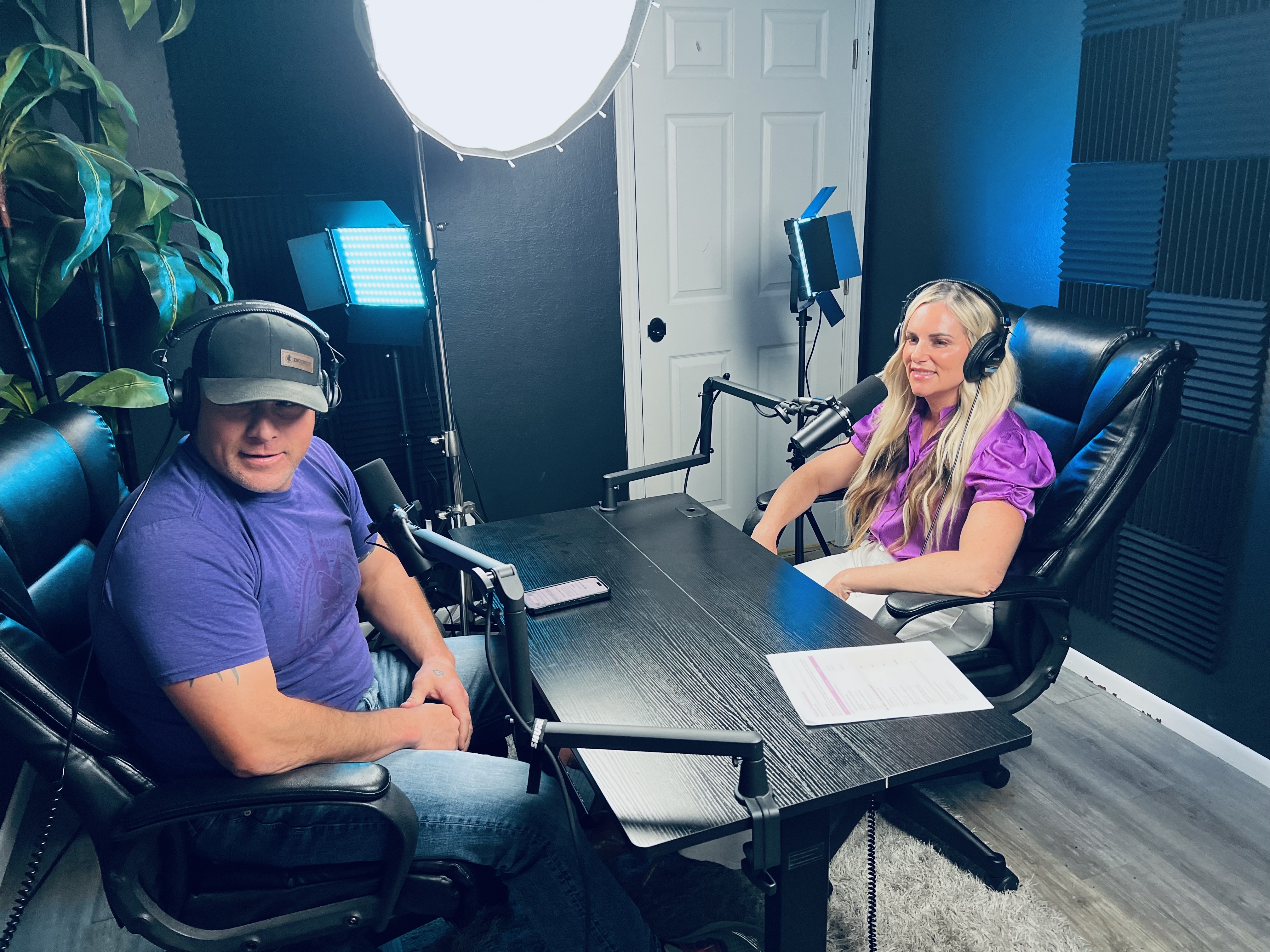 Two people recording a podcast at BLP Creative Studio