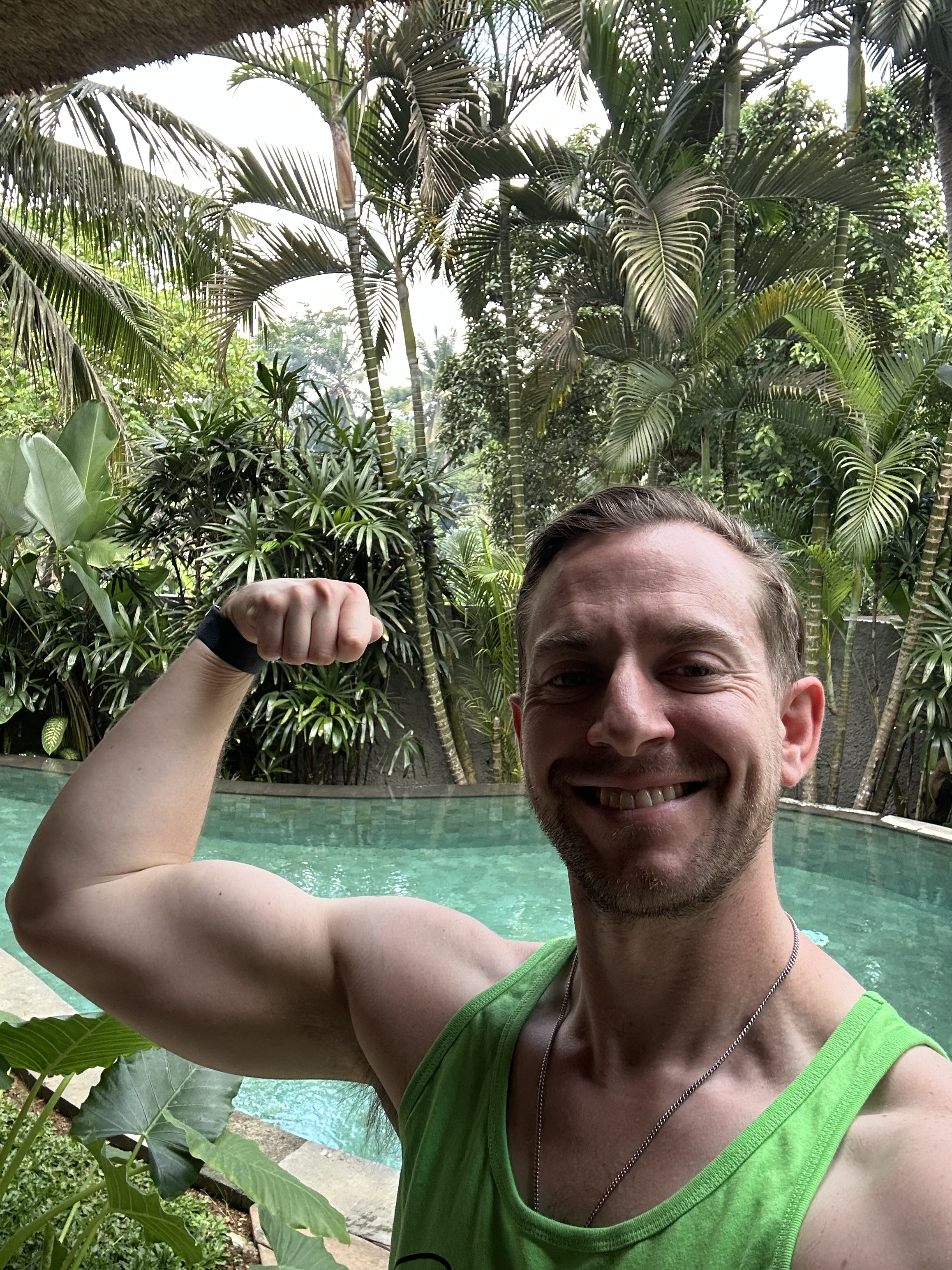 Spencer Gallo flexing by a pool, showing a lean, muscular physique
