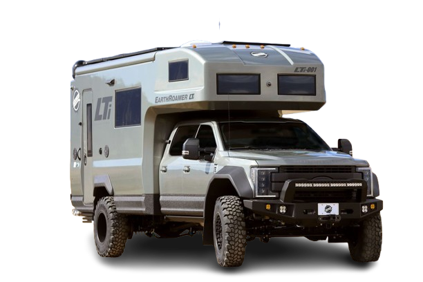 A rugged gray RV with a pop-up camper section.