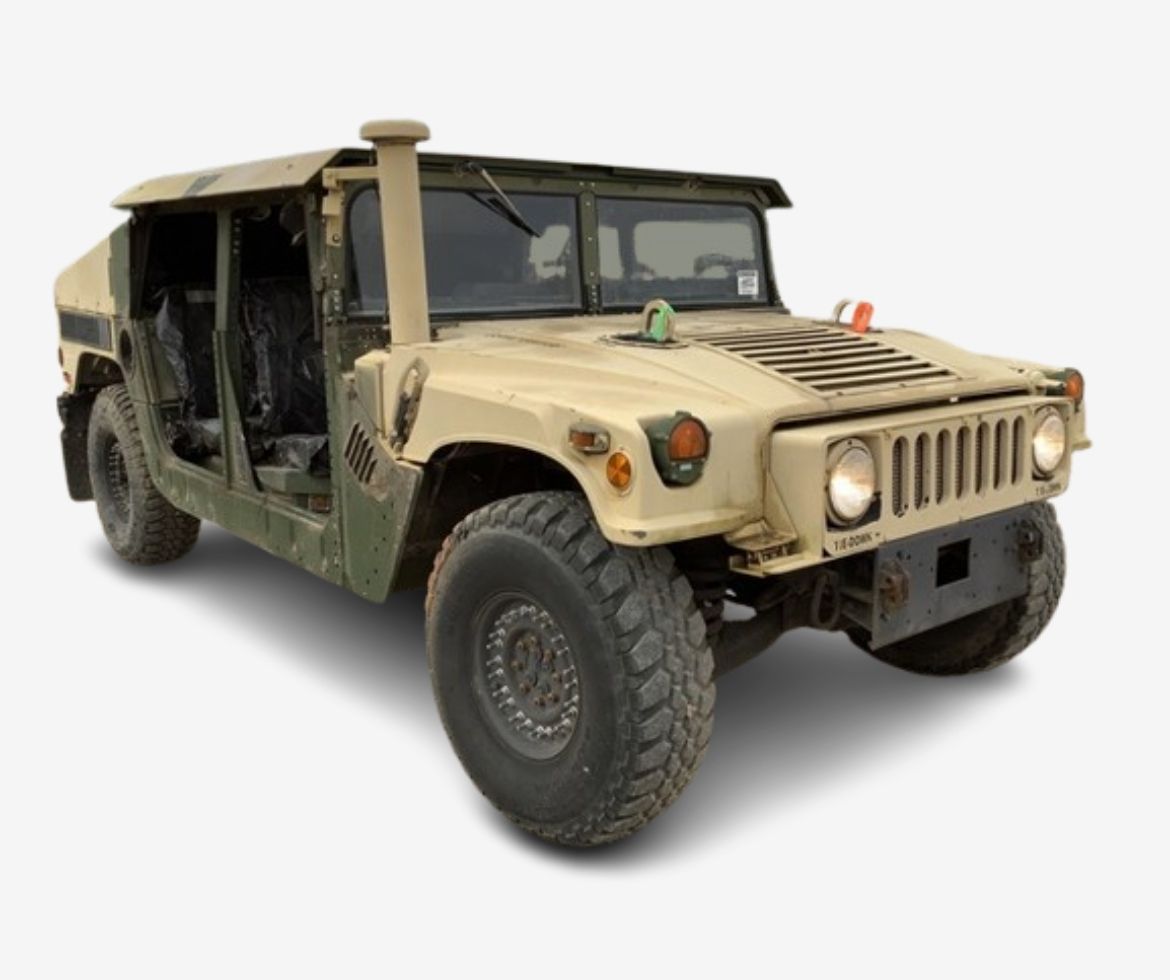 A tan military Humvee with its doors open, featuring a rugged design and large off-road tires, ready for military vehicle registration in a tactical setting.