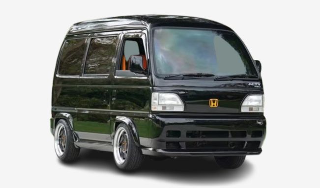A black honda van with a sleek design and custom wheels