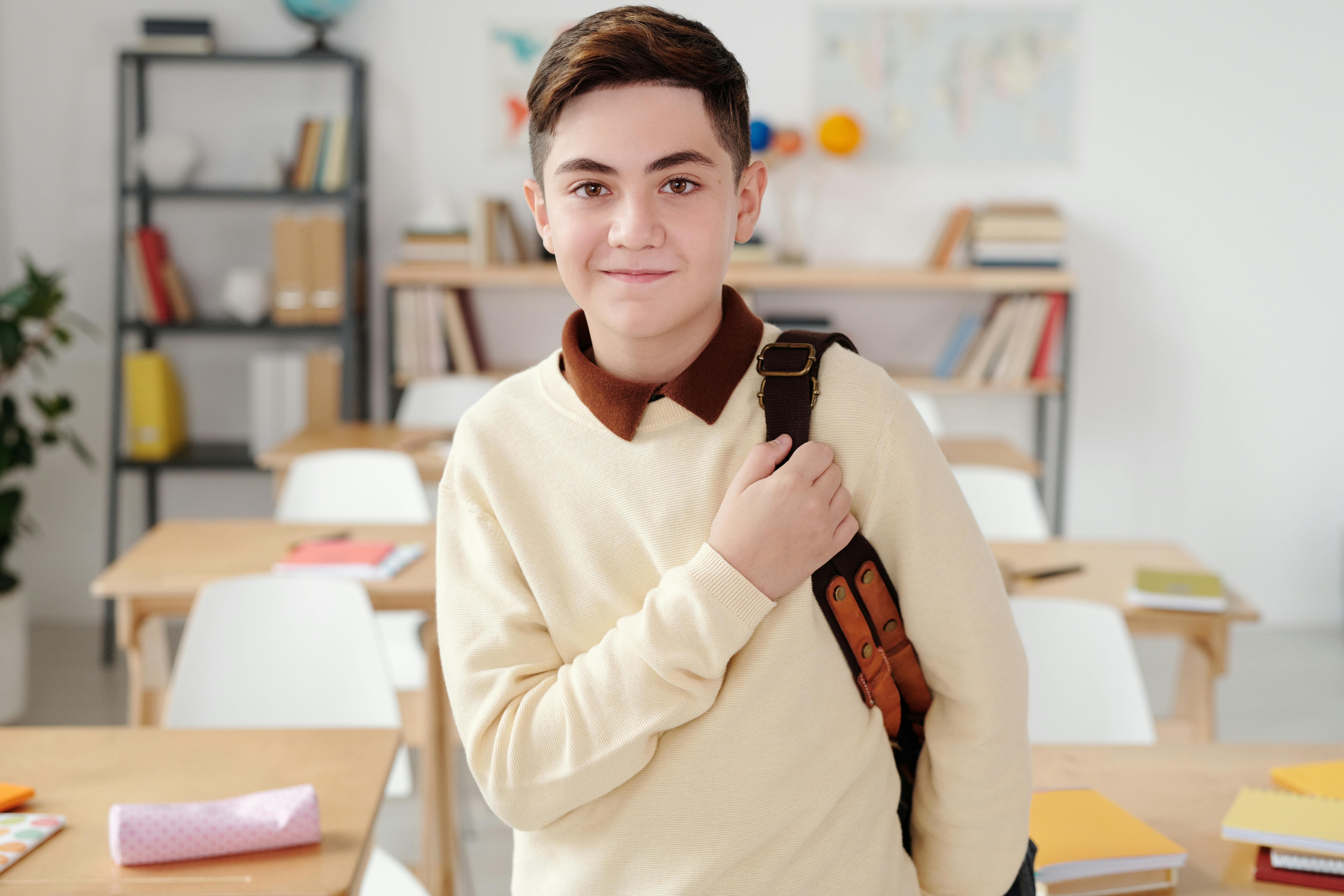 Confident happy child at school