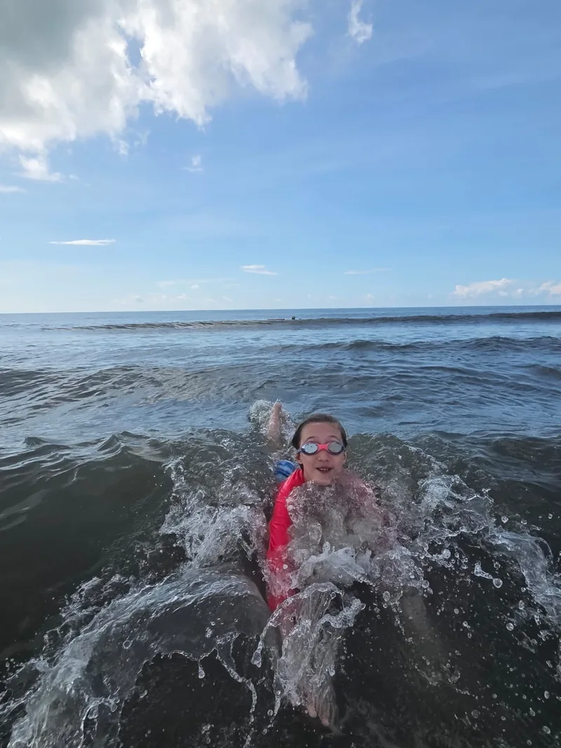 Swimmer in goggles practicing in the ocean