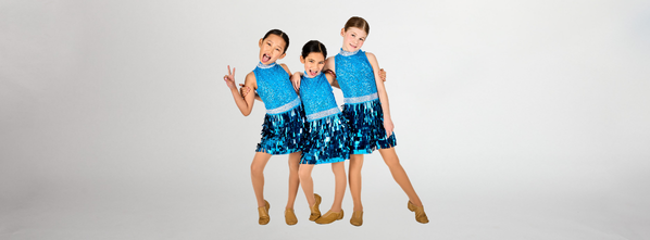 Three Dance Connections dancers in sparkling blue jazz costumes