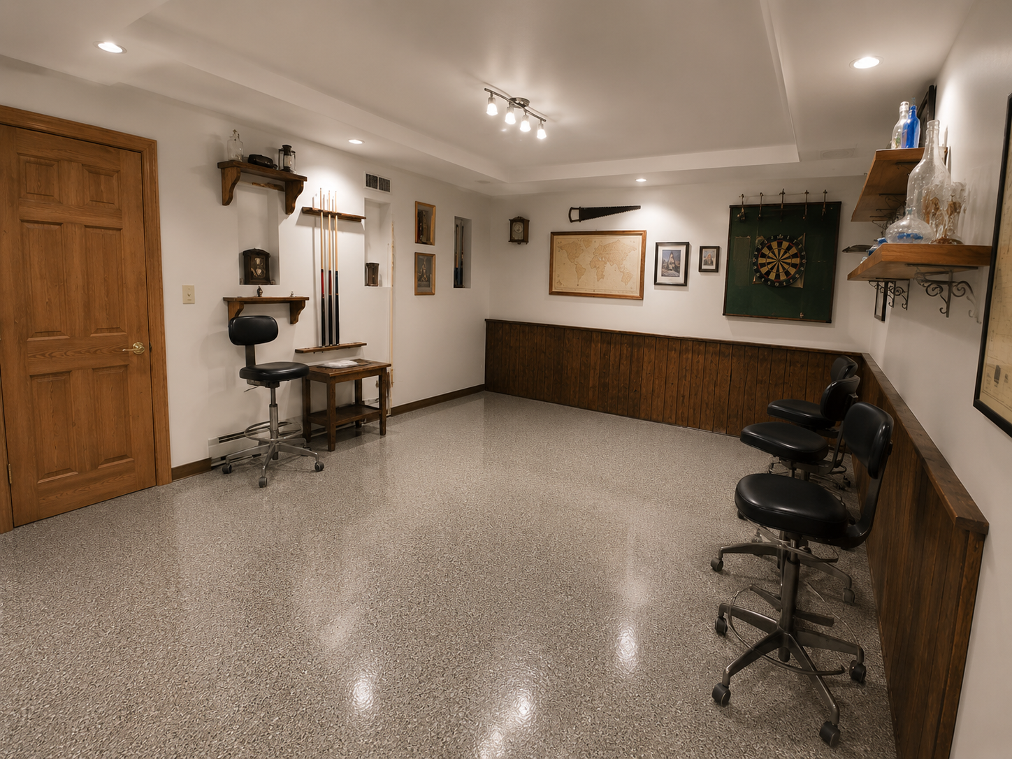 Gray flake epoxy floor coating finished basement game room Central Florida - Protocol Home Services