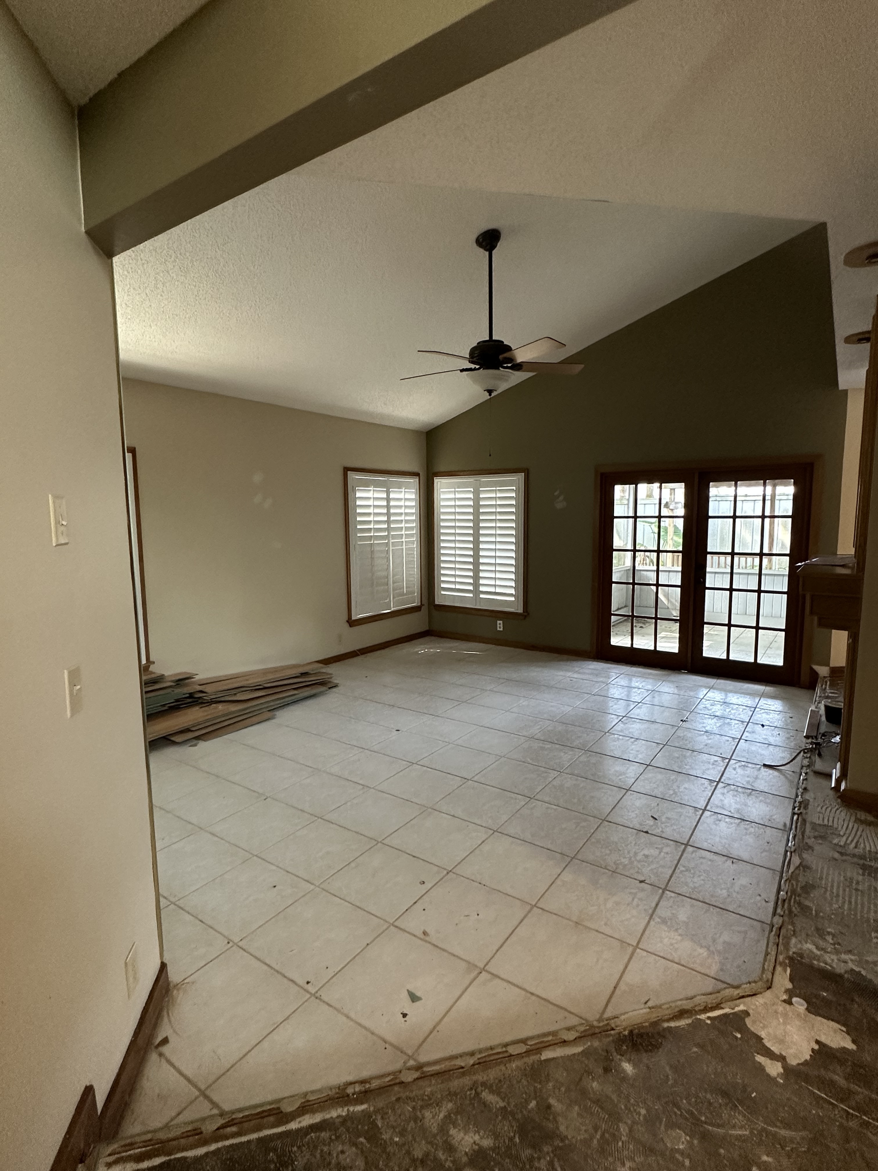 Living room before polished concrete floor installation Seminole County FL - Protocol Home Services