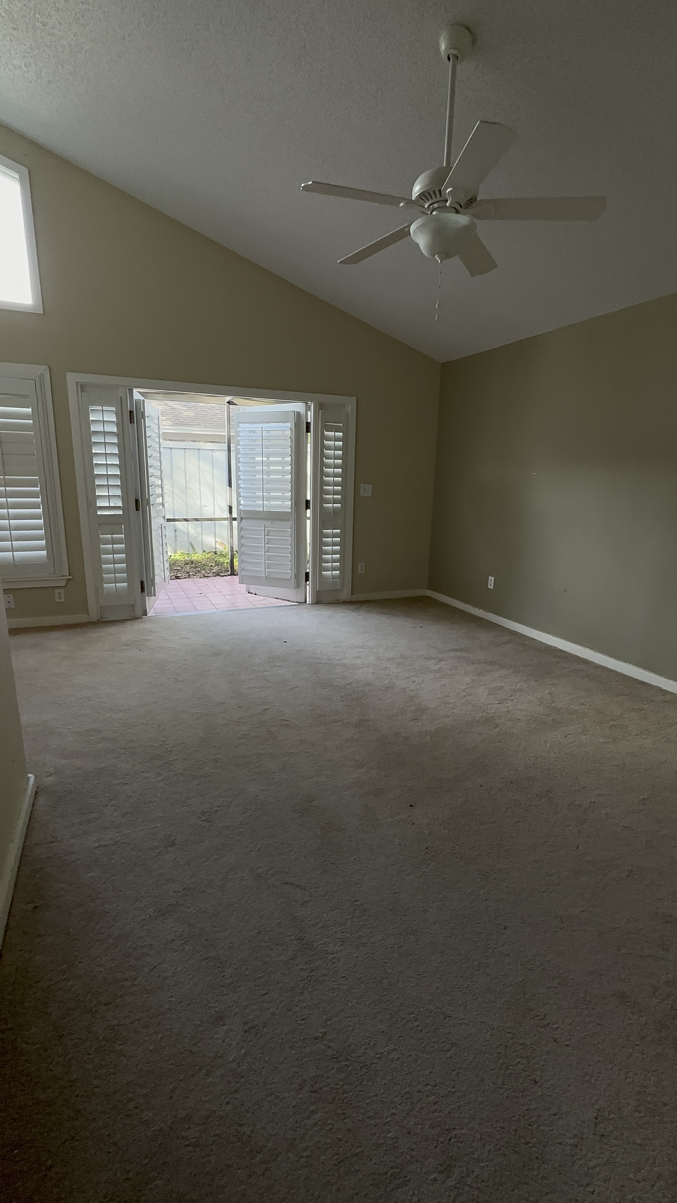 Bedroom with beige carpet before polished concrete floor Seminole County FL - Protocol Home Services