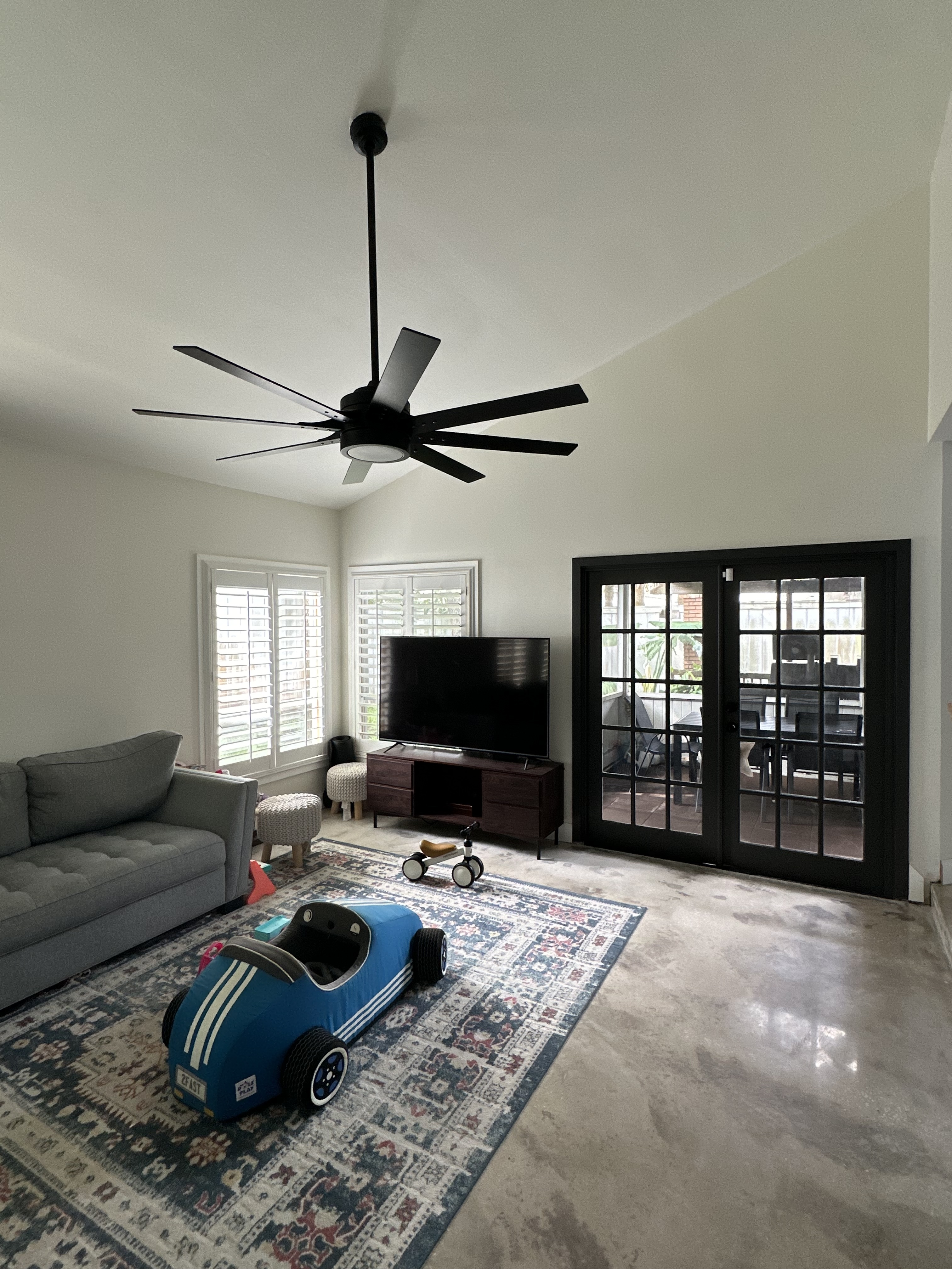 Polished concrete floor vaulted ceiling living room Central Florida - Protocol Home Services