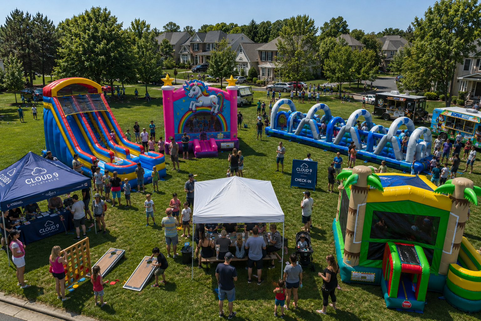 Community event with multiple Cloud 9 inflatables set up on a neighborhood green