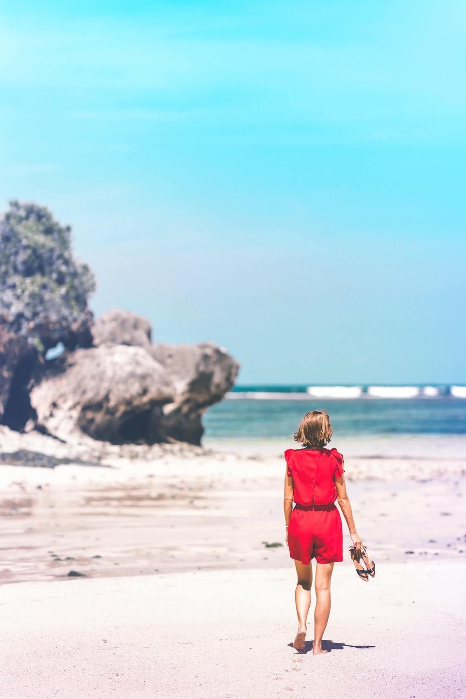 Woman walking along the beach