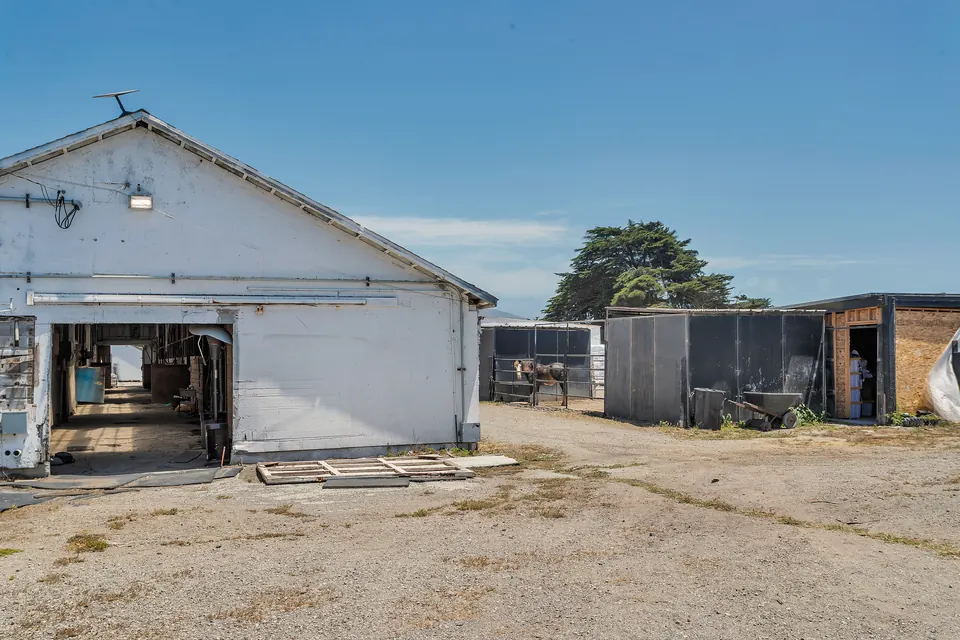 The white barn at Ocean View Stables on a clear day
