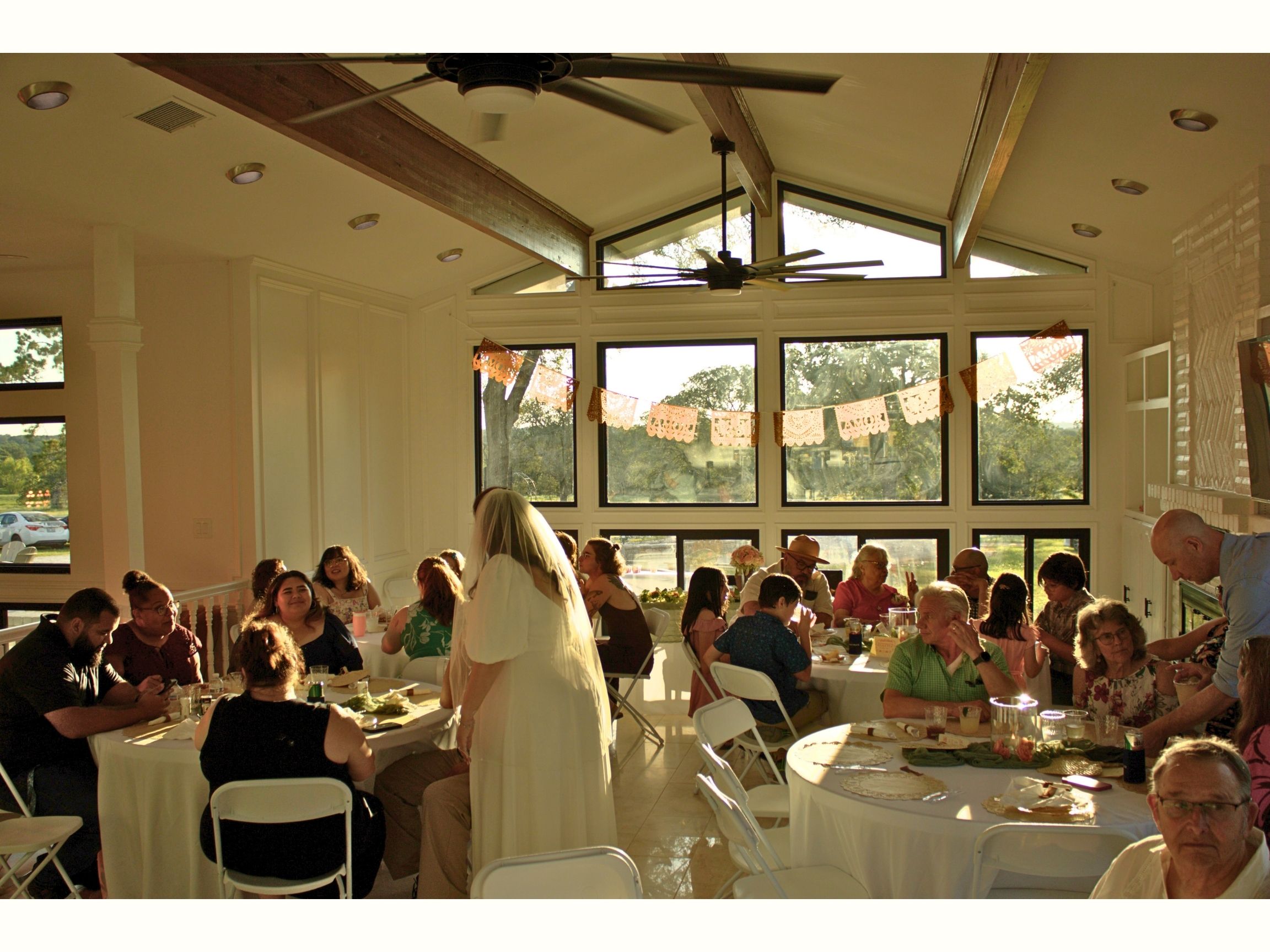 Guests seated at a reception banquet in a Central Texas event venue