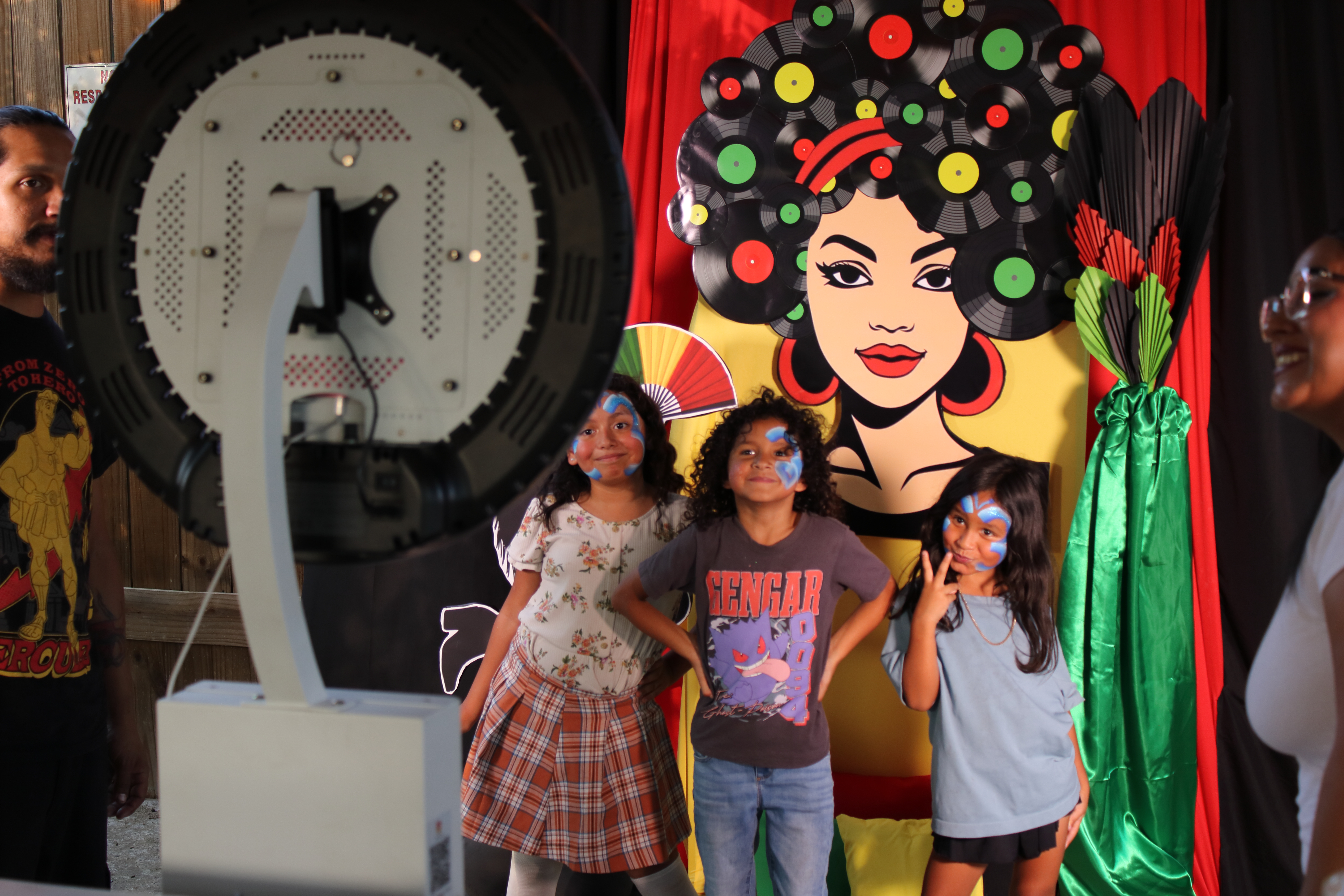 Guests posing at a Royal DaViNE Media photo booth during a Central Texas event