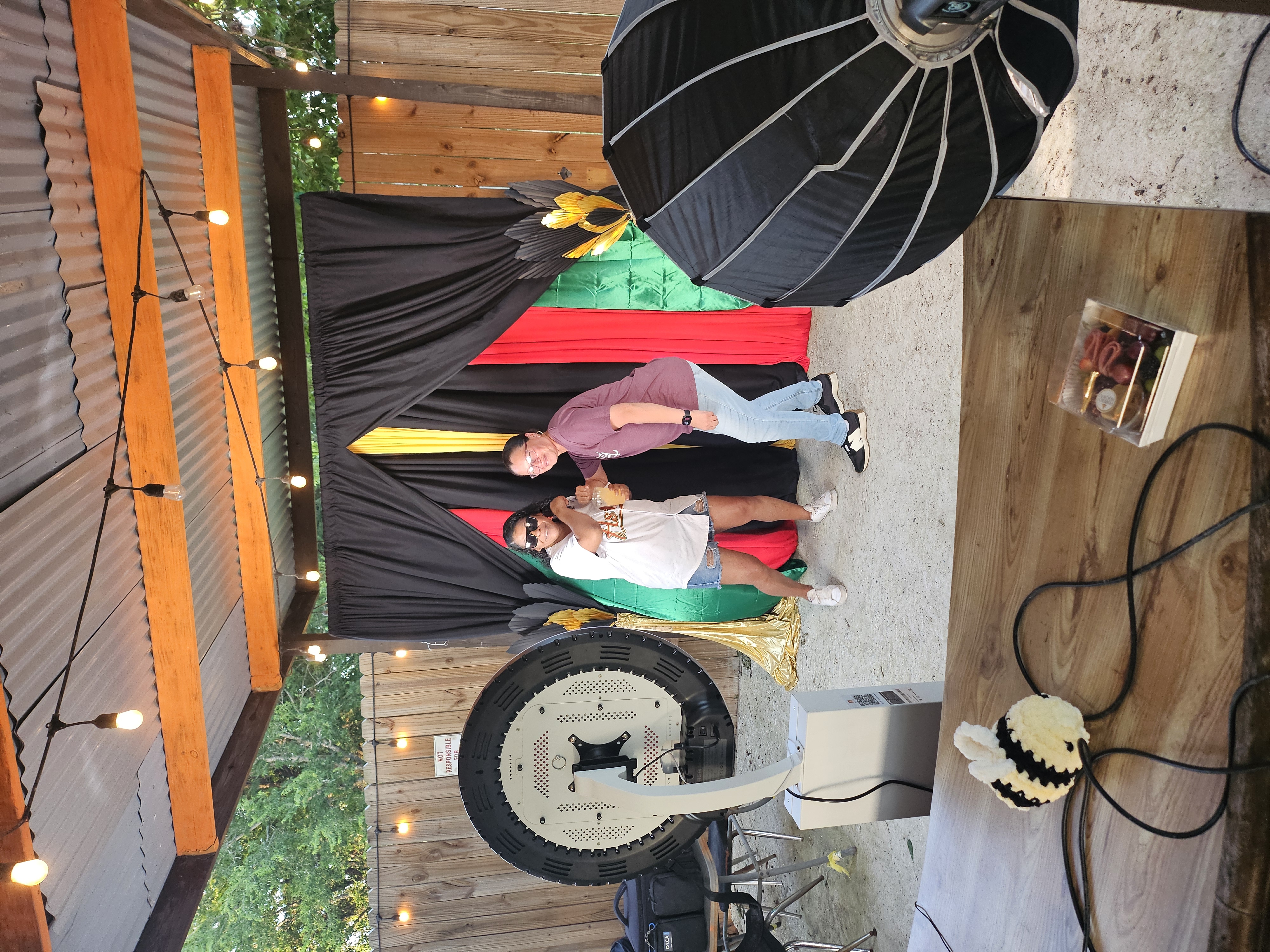 Photo booth backdrop styled for an outdoor celebration in Central Texas