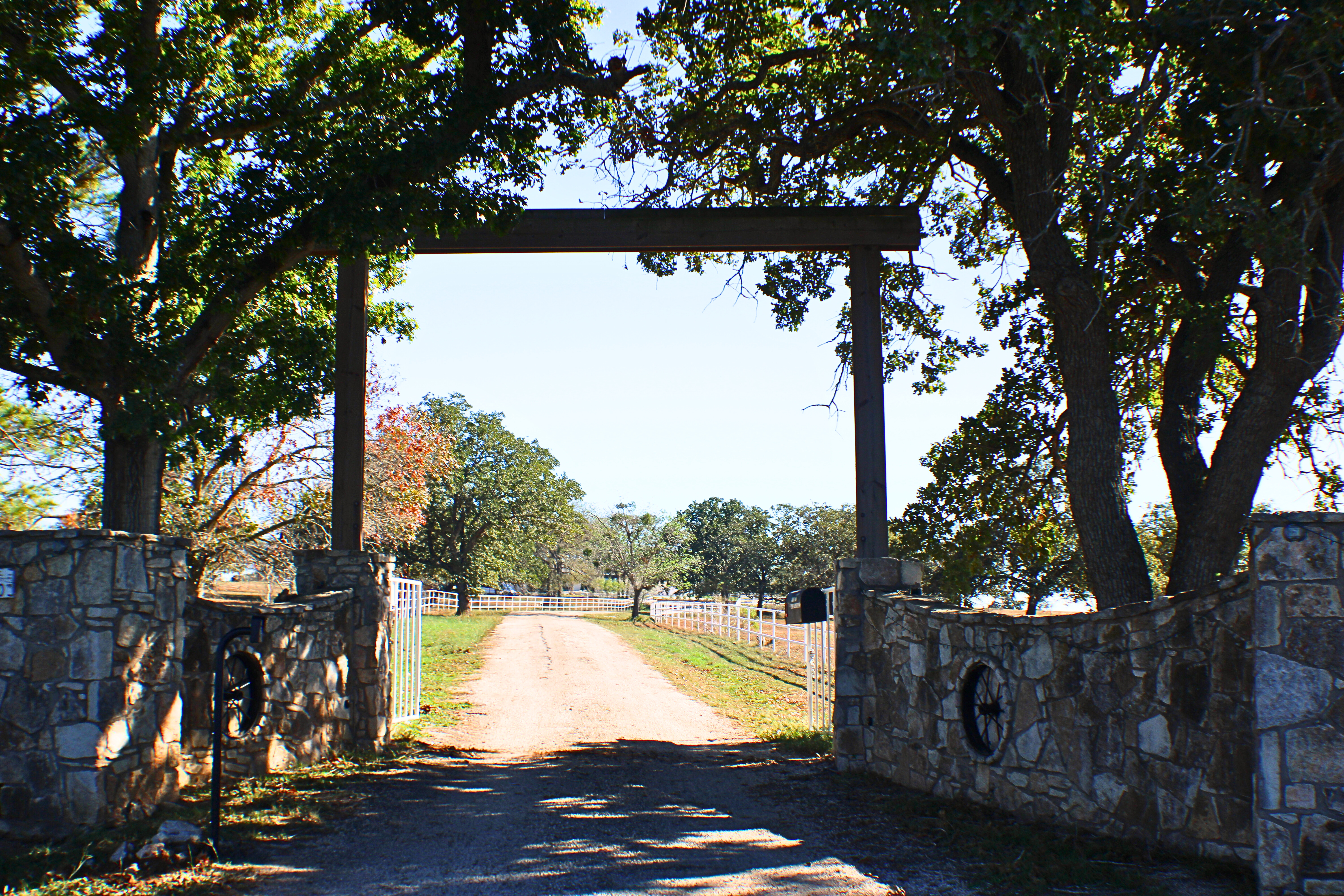 Stone ranch entry gate photographed at a Central Texas event venue