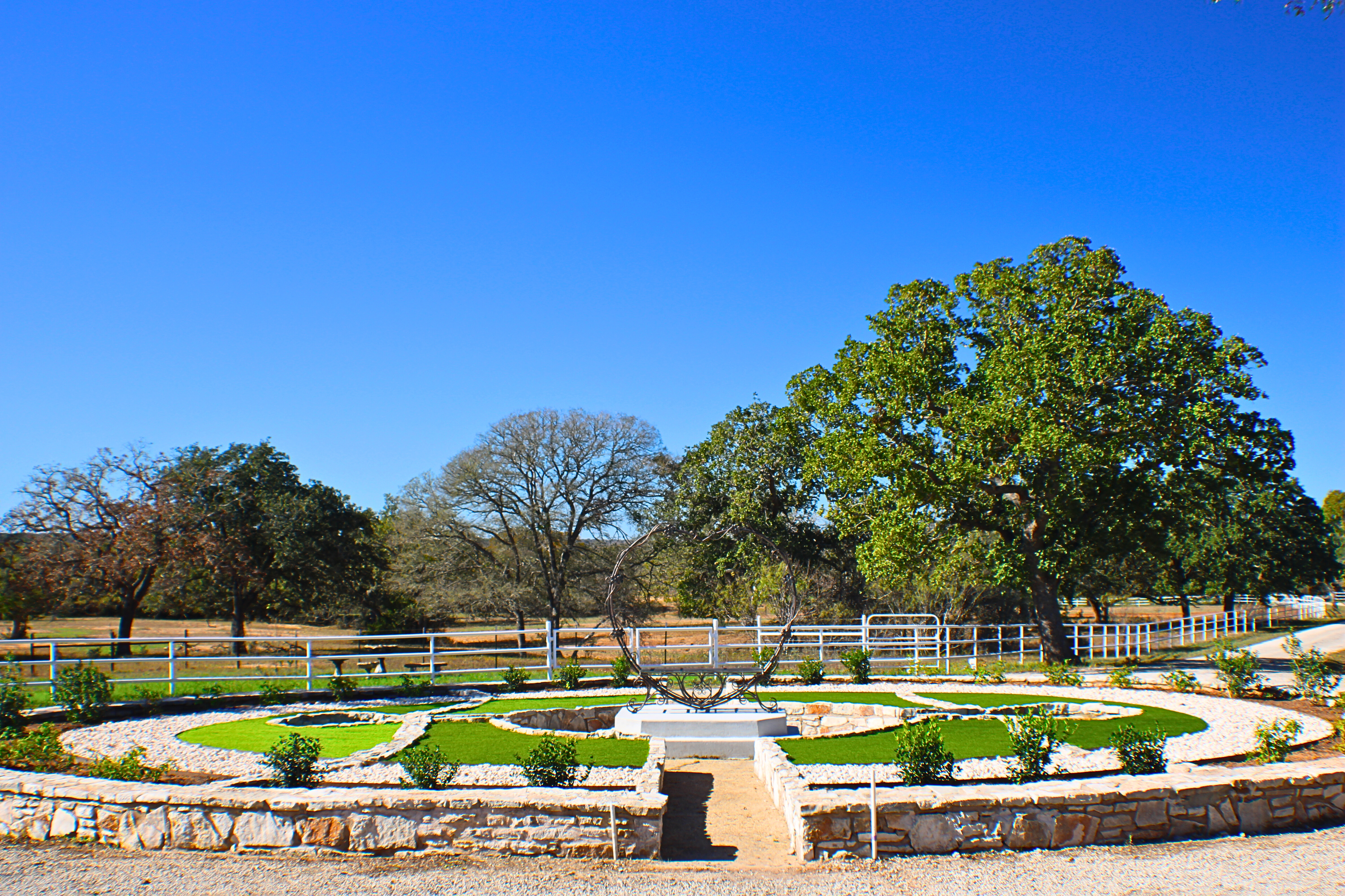 Formal garden and fountain photographed at a Central Texas event venue