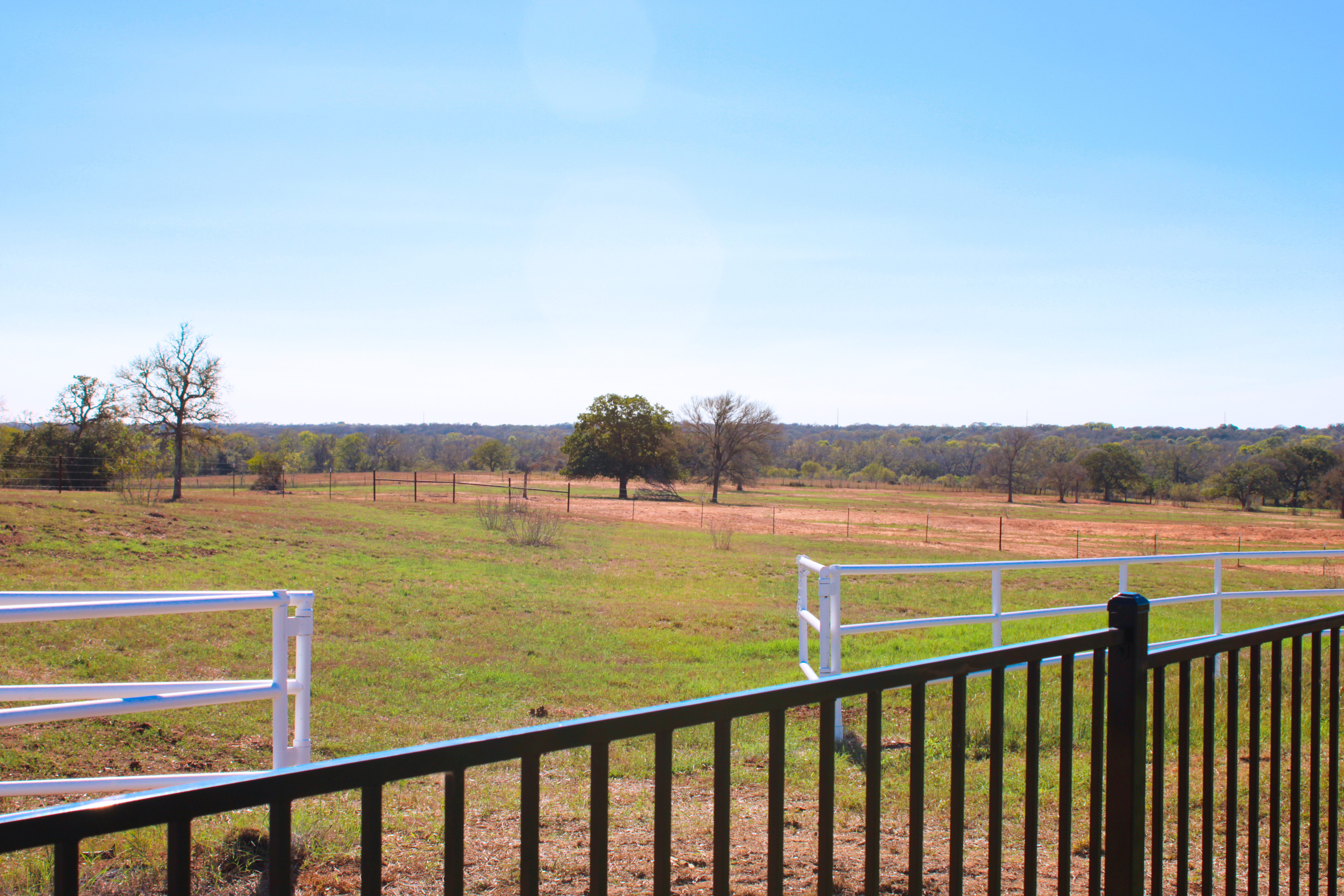 Fenced pasture and property views photographed at a Central Texas venue