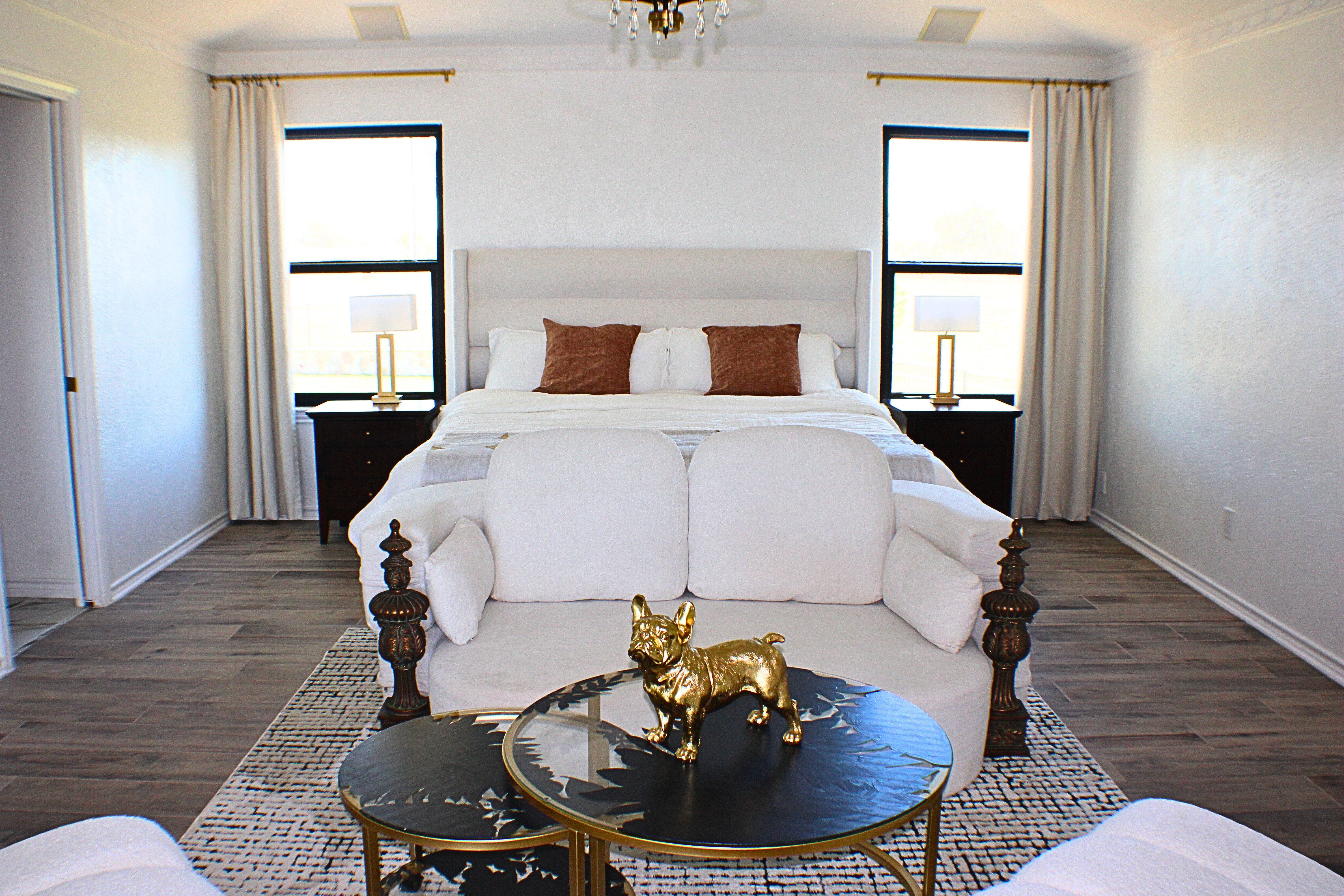 Staged primary bedroom photographed for a real estate listing in Central Texas