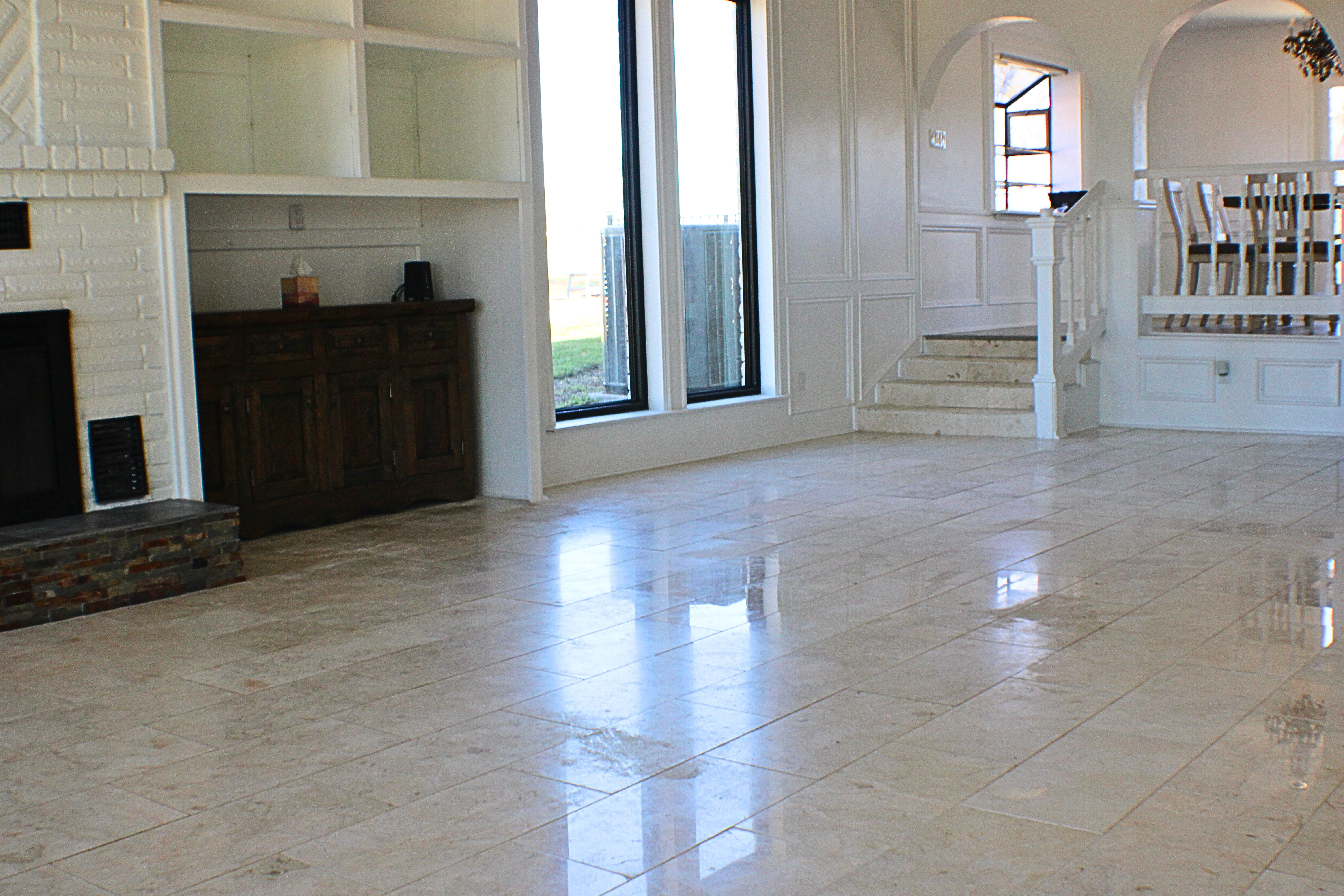 Open floor plan interior with fireplace photographed for a Central Texas listing