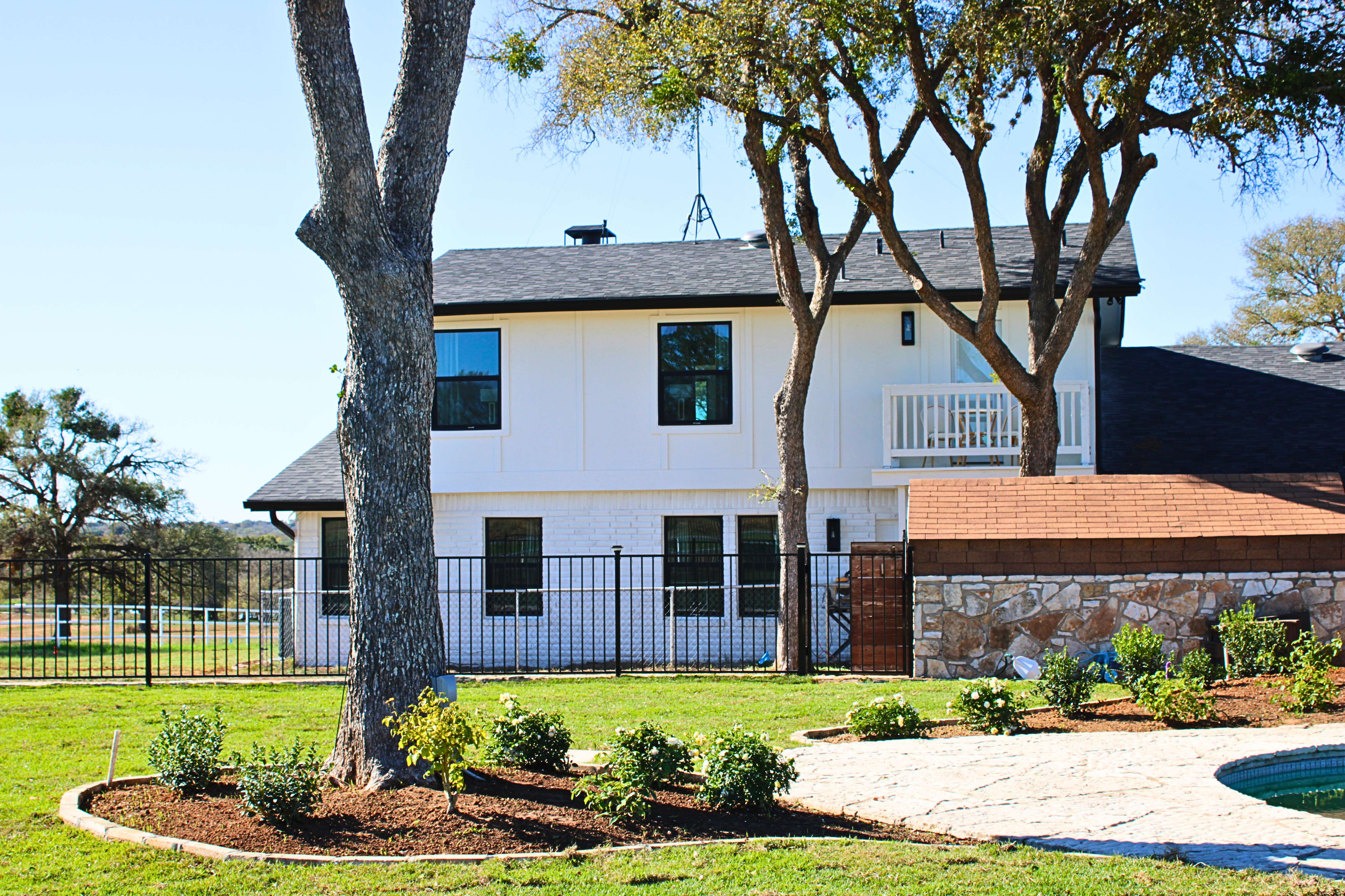 Two-story home exterior photographed for a Central Texas property listing