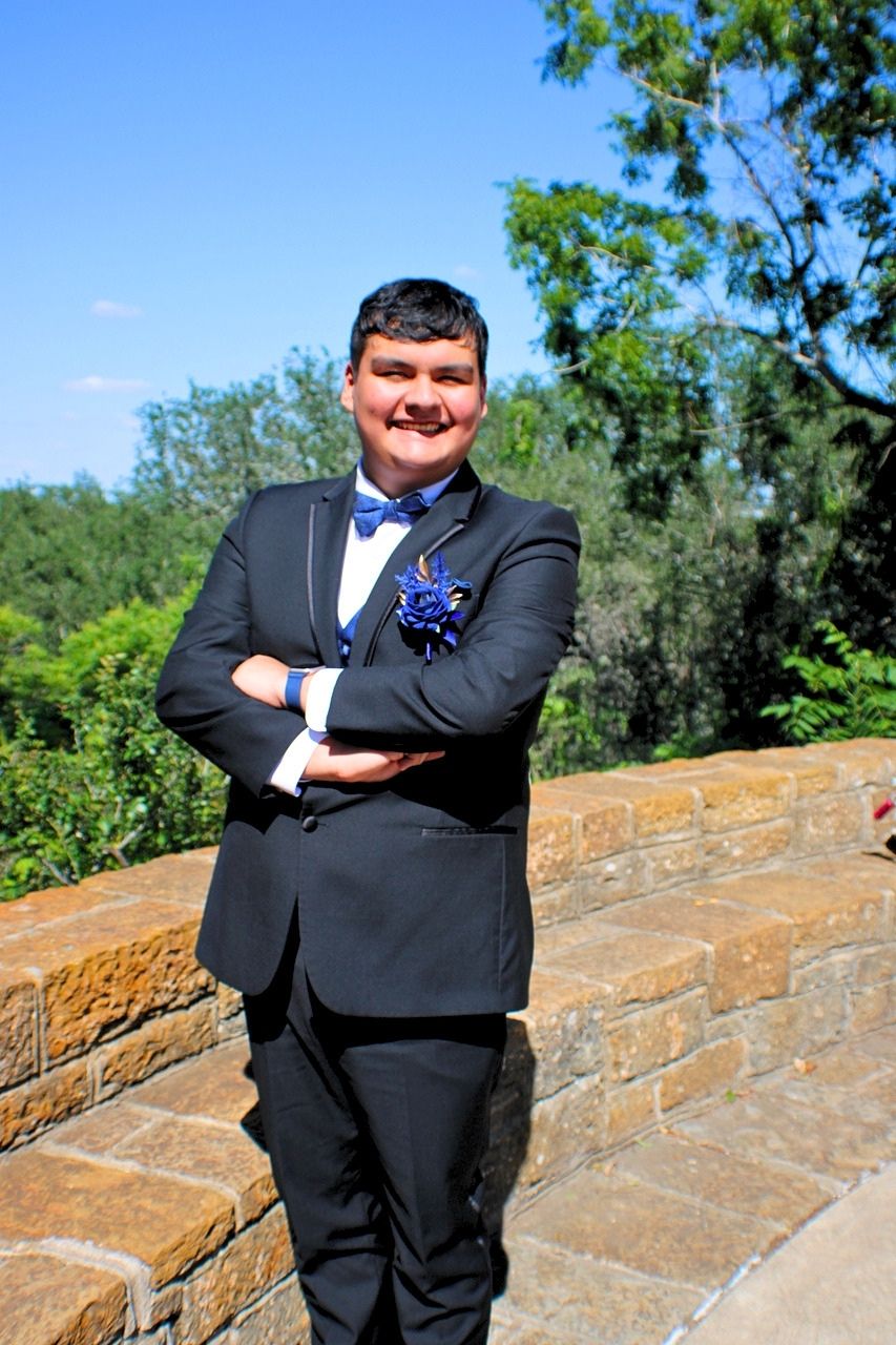 Formal prom portrait of a young man photographed in Lockhart, Texas