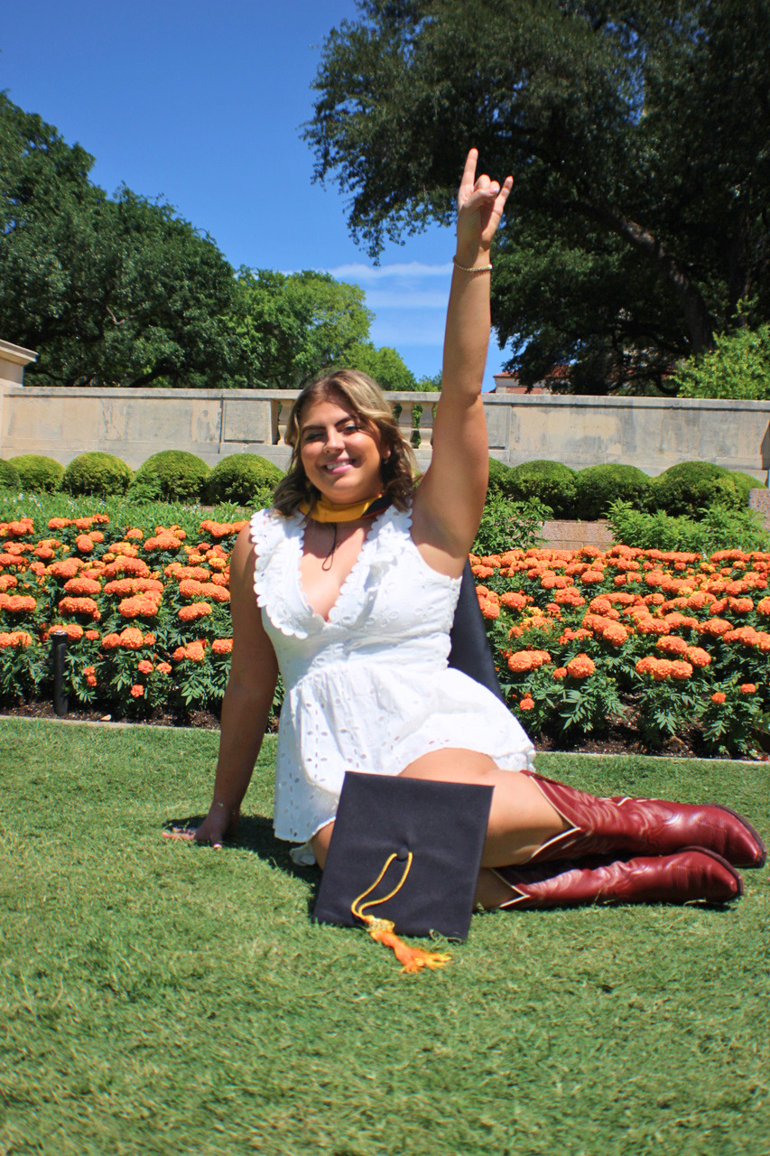 Graduation portrait session with cap and diploma photographed in Central Texas