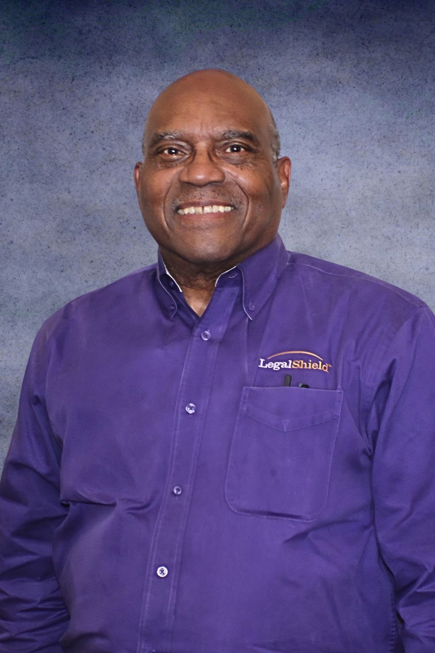 Corporate headshot in branded company uniform photographed in a Central Texas studio