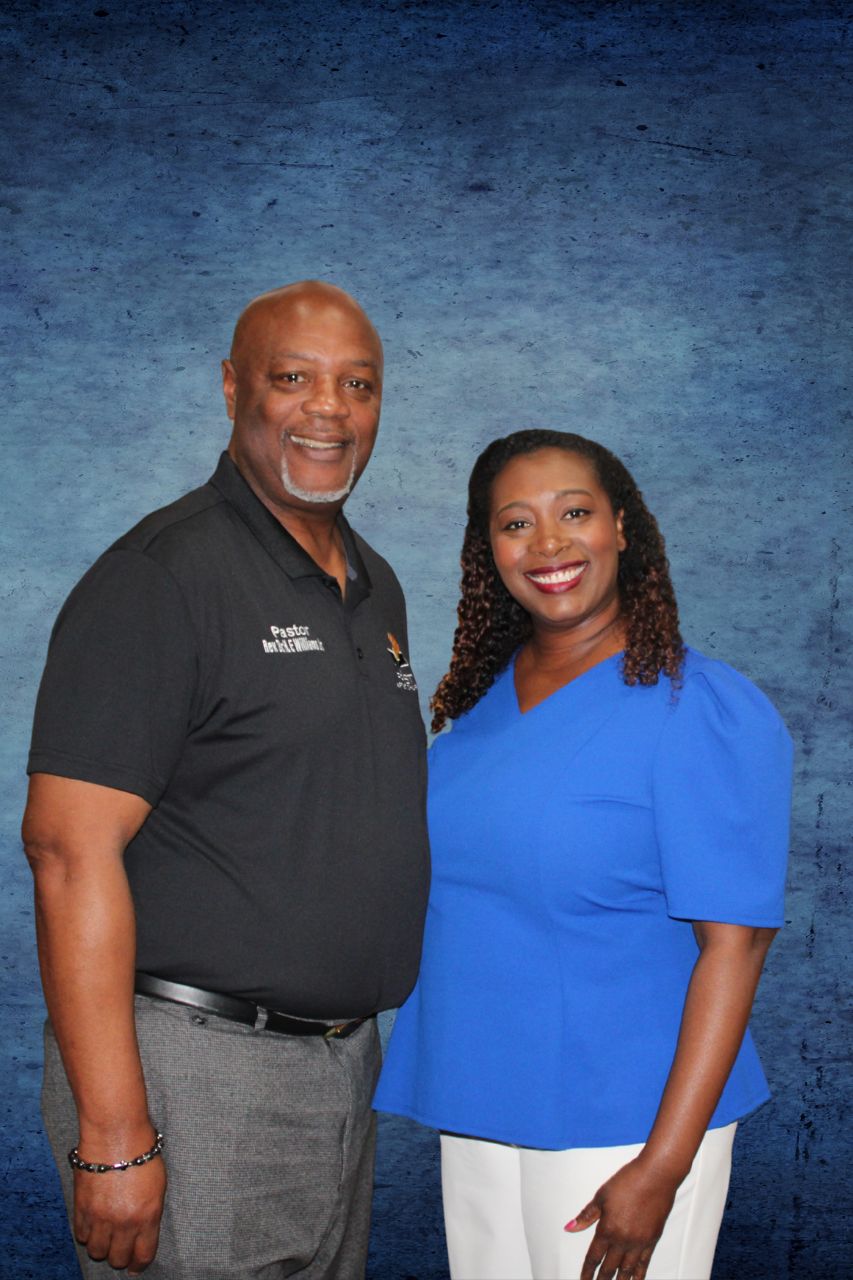 Two-person business team headshot photographed on a studio backdrop in Central Texas