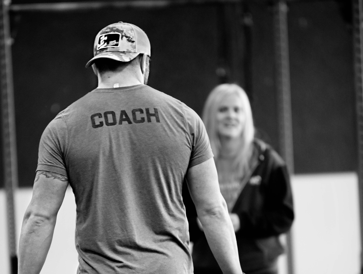 Coach working with a member at Joplin Strength and Fitness