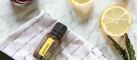 lemon essential oil and slice of lemon