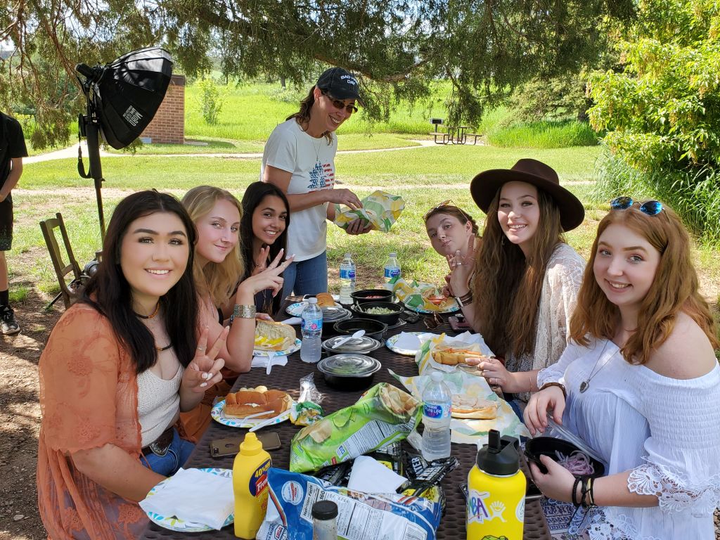 Carols Crew senior rep team girls in patriotic outfits holding soda bottles fort collins colorado