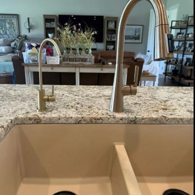 Dedicated reverse osmosis drinking faucet beside the main kitchen faucet