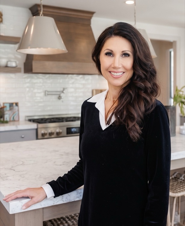 Stephanie Keate, Realtor, in a kitchen
