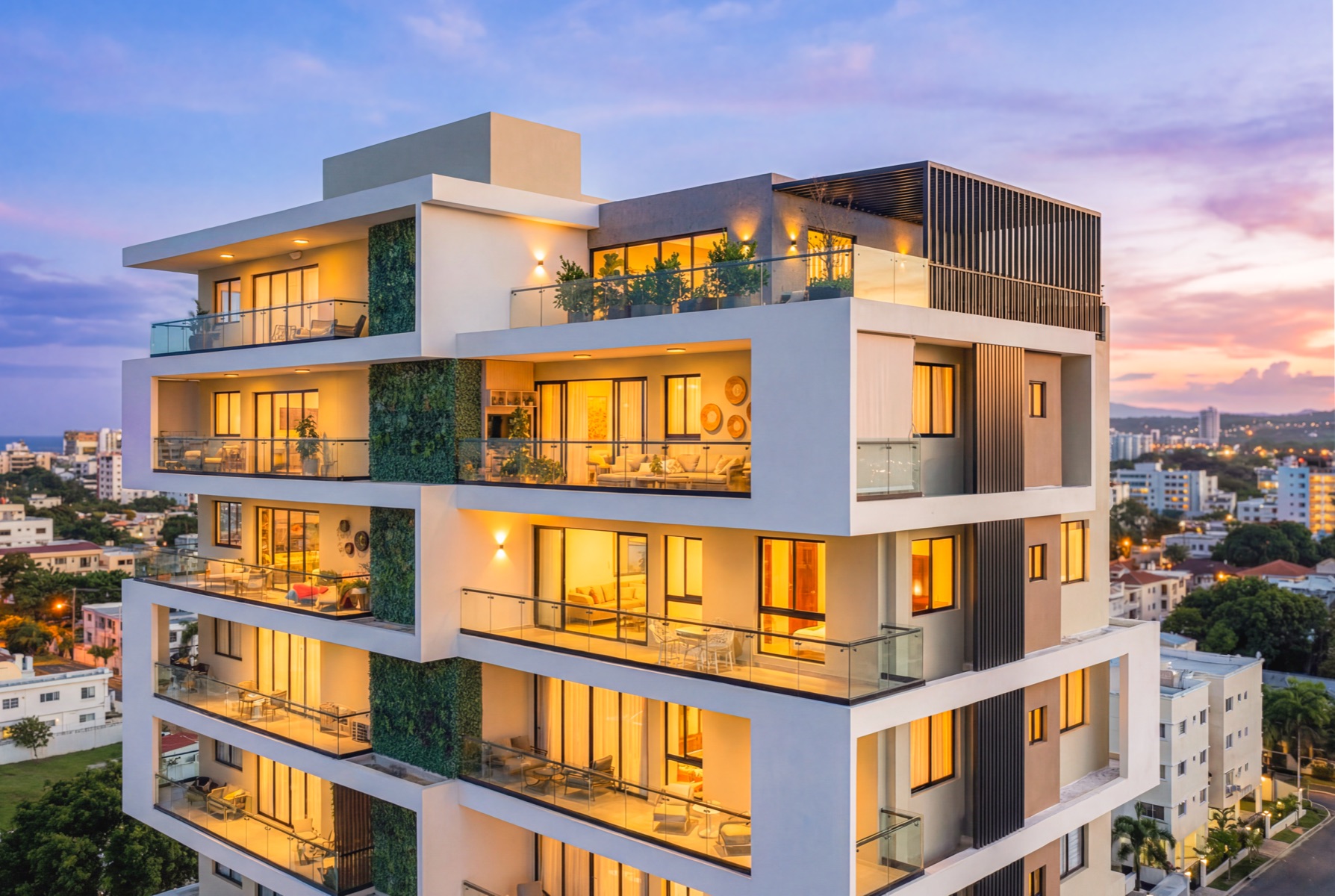 Residential tower at twilight with lit balconies, Santiago