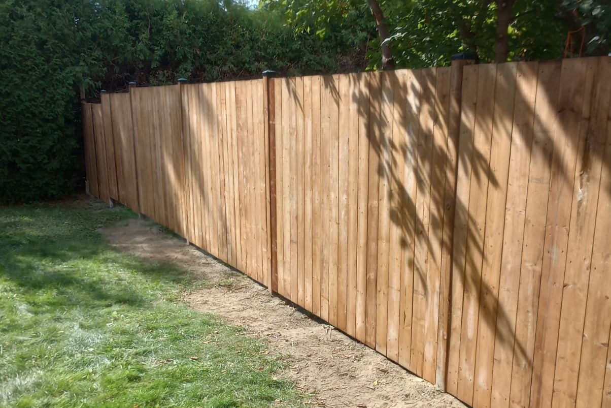 Wood fence installation in Russell