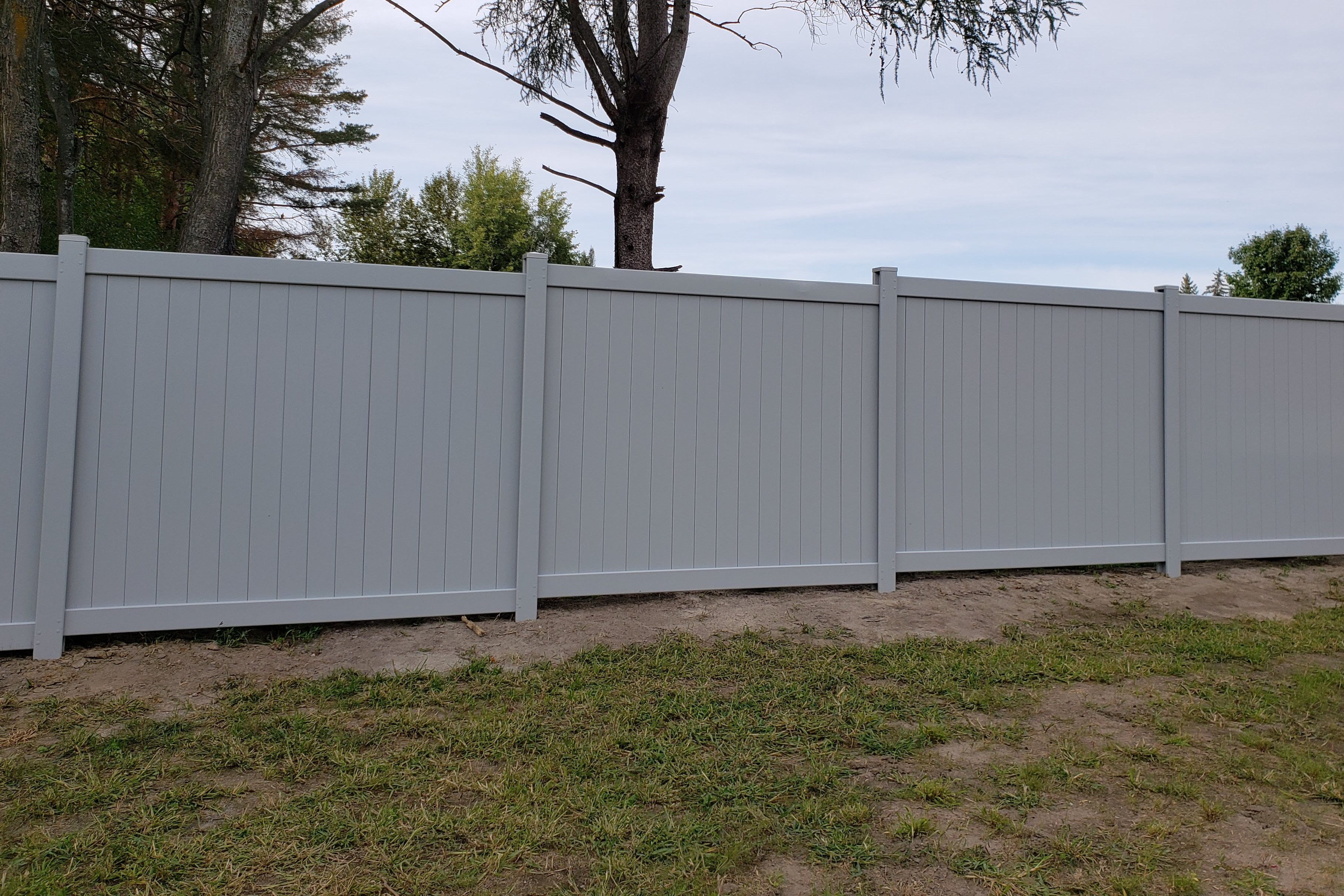 Gray PVC privacy fence installation Ottawa