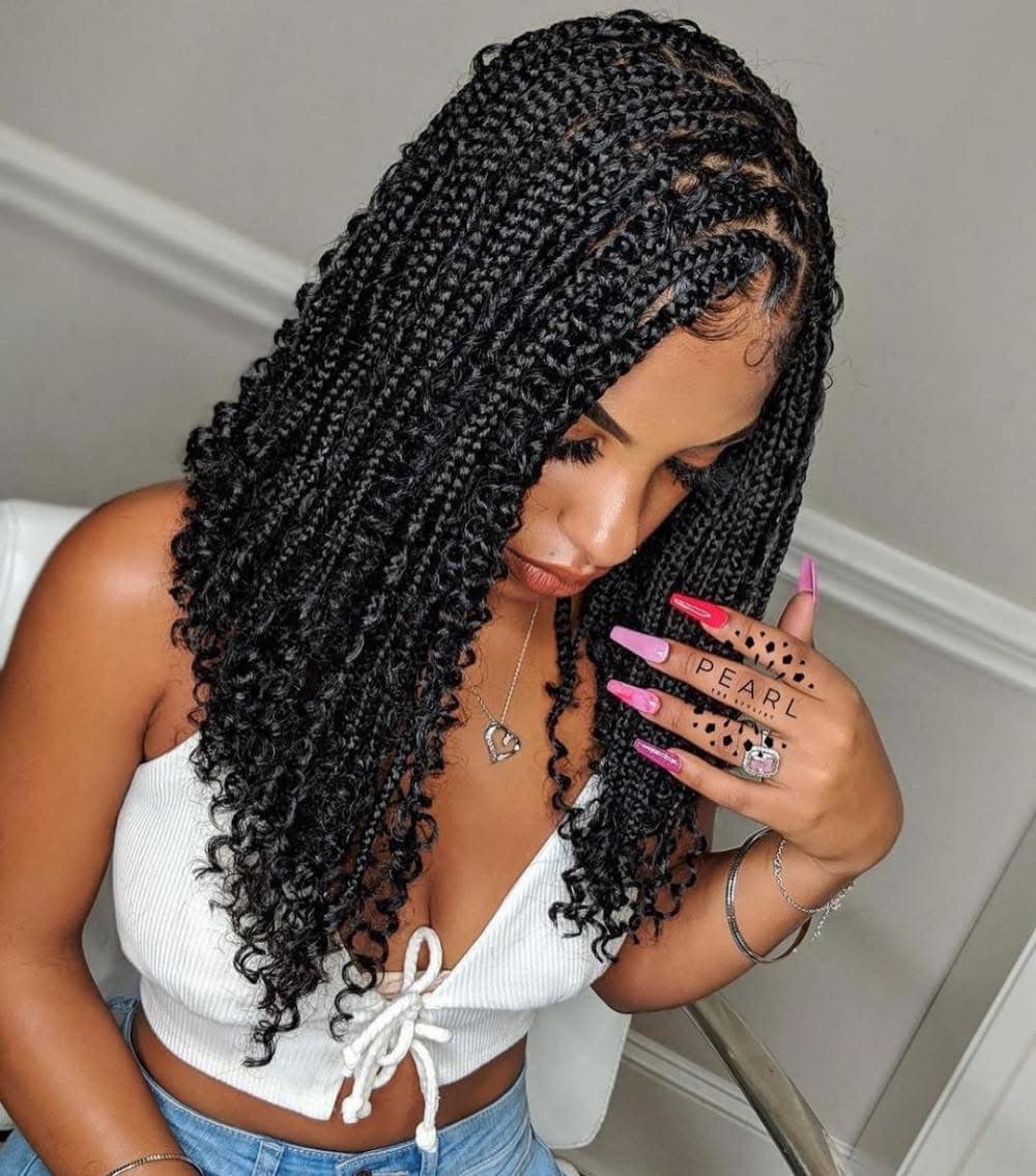 Half-down black knotless box braids hairstyle