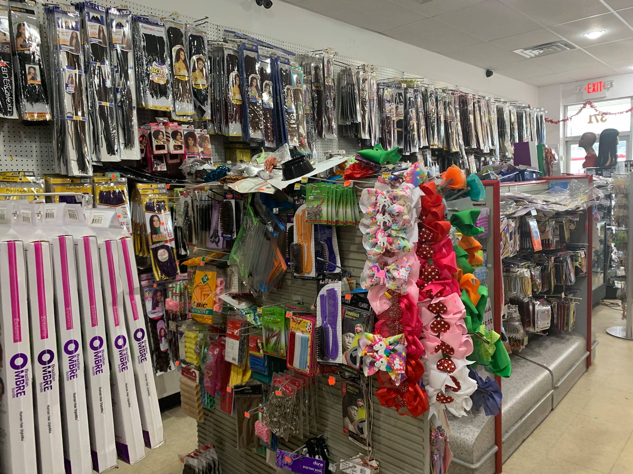 Mimi Beauty Supply store aisle stocked with hair extensions and accessories