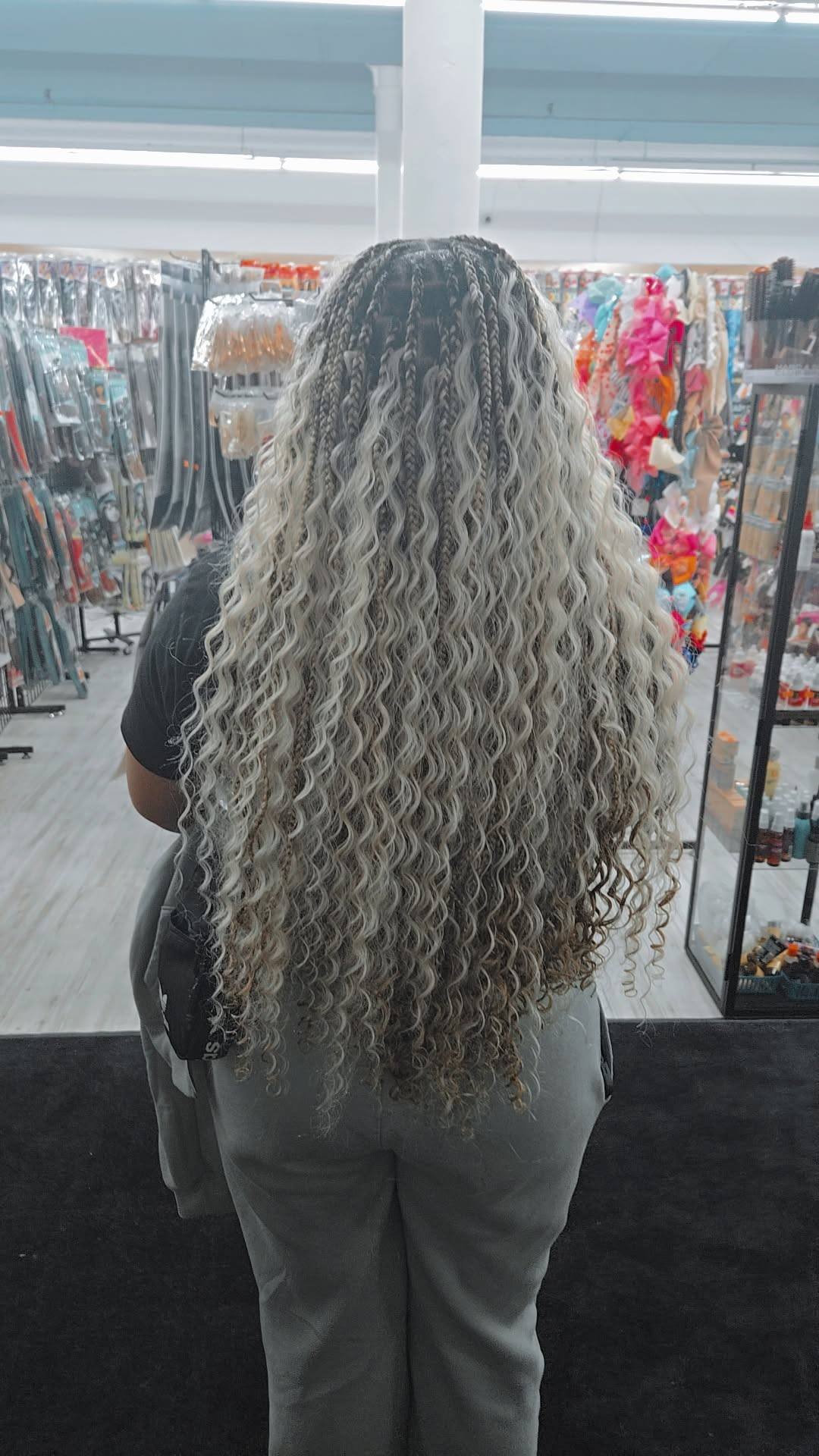Silver platinum goddess locs styled at Mimi Beauty Supply