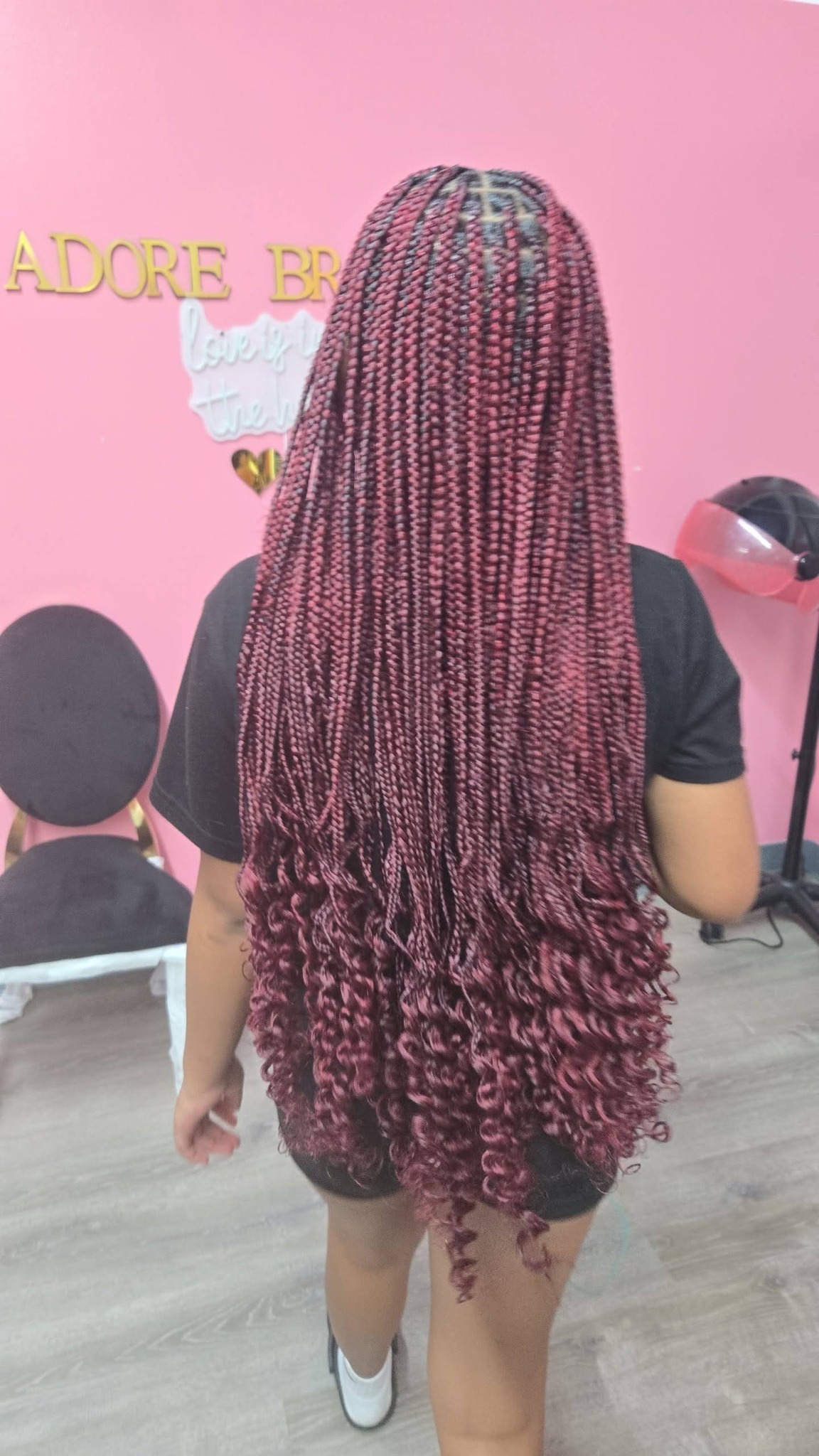Pink magenta box braids photographed in pink studio